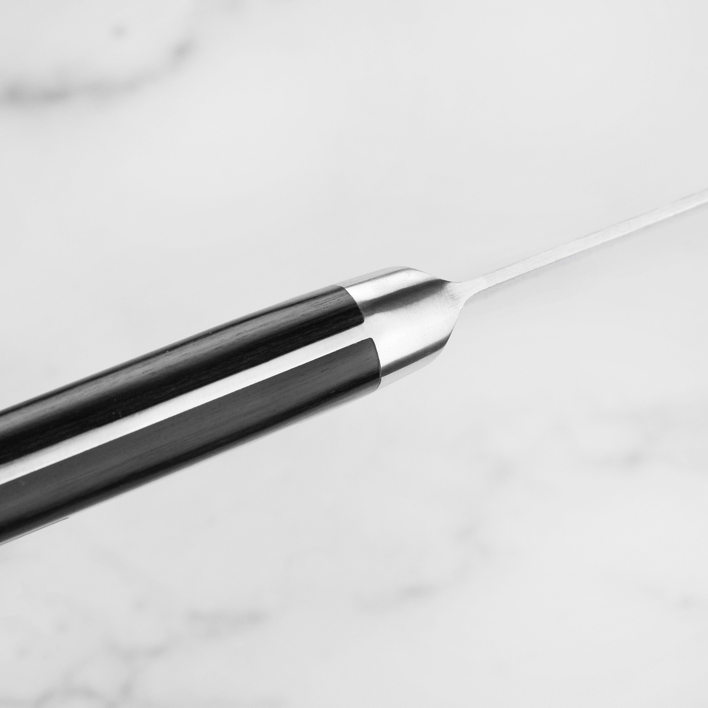 Misono Swedish knife in use, showcasing its effectiveness in slicing vegetables precisely.