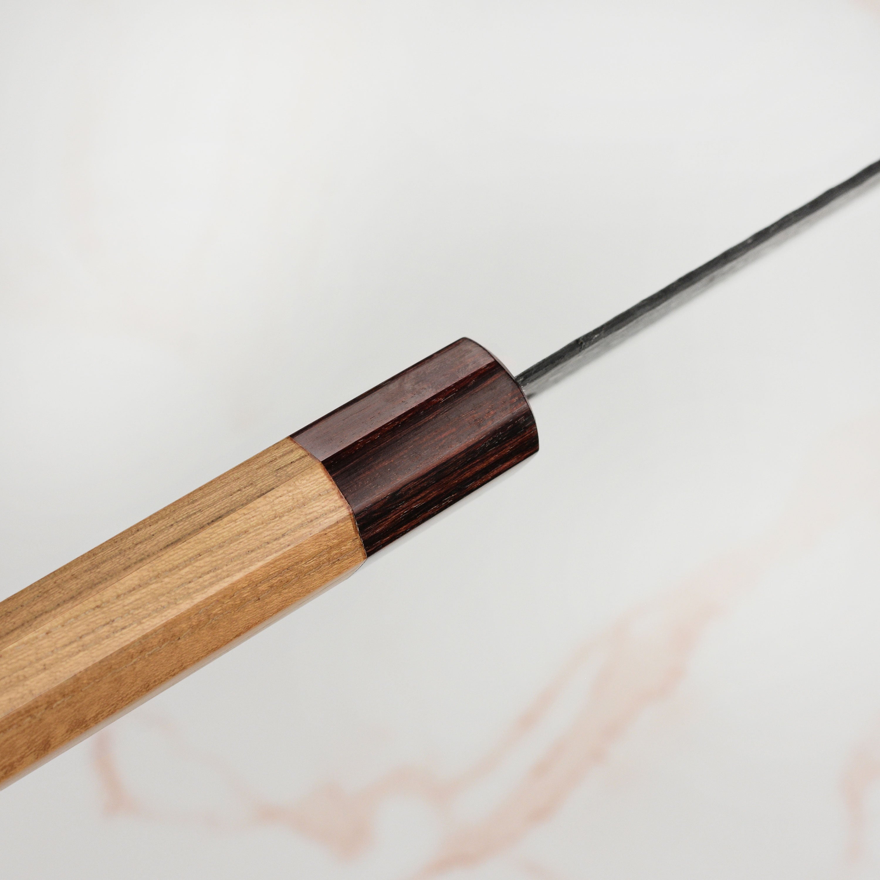 Display of the Takayuki Aogami Super Kurouchi knife with Zelkova wood handle