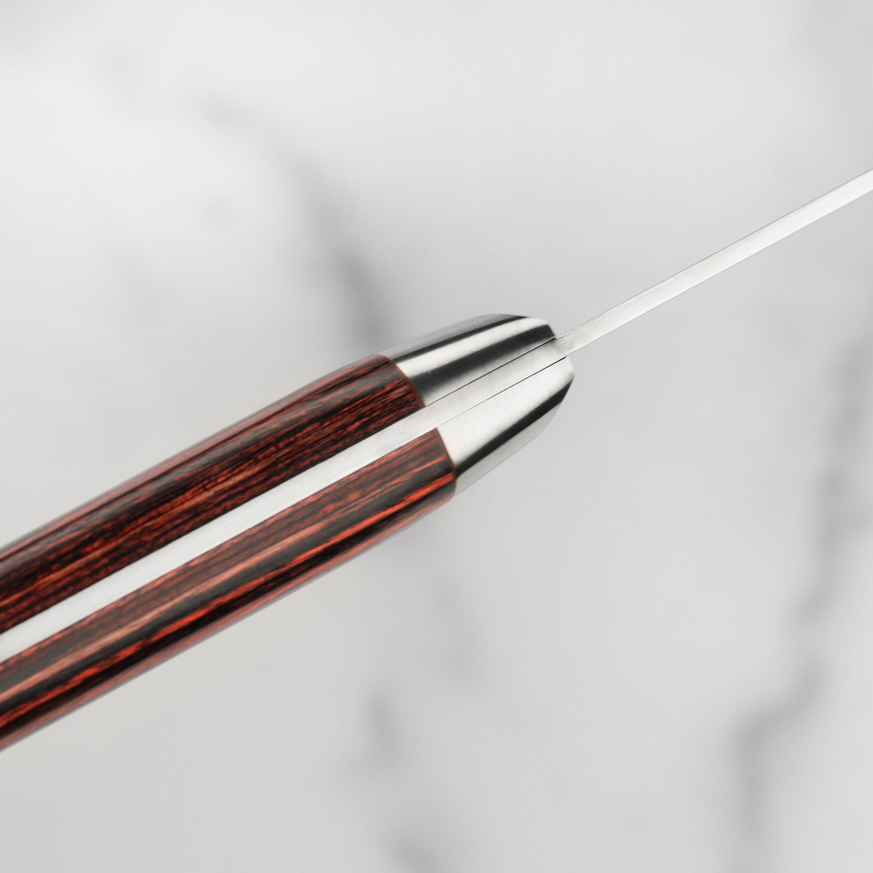 Utility knife in use, demonstrating its sharpness and ergonomic design for easy handling.
