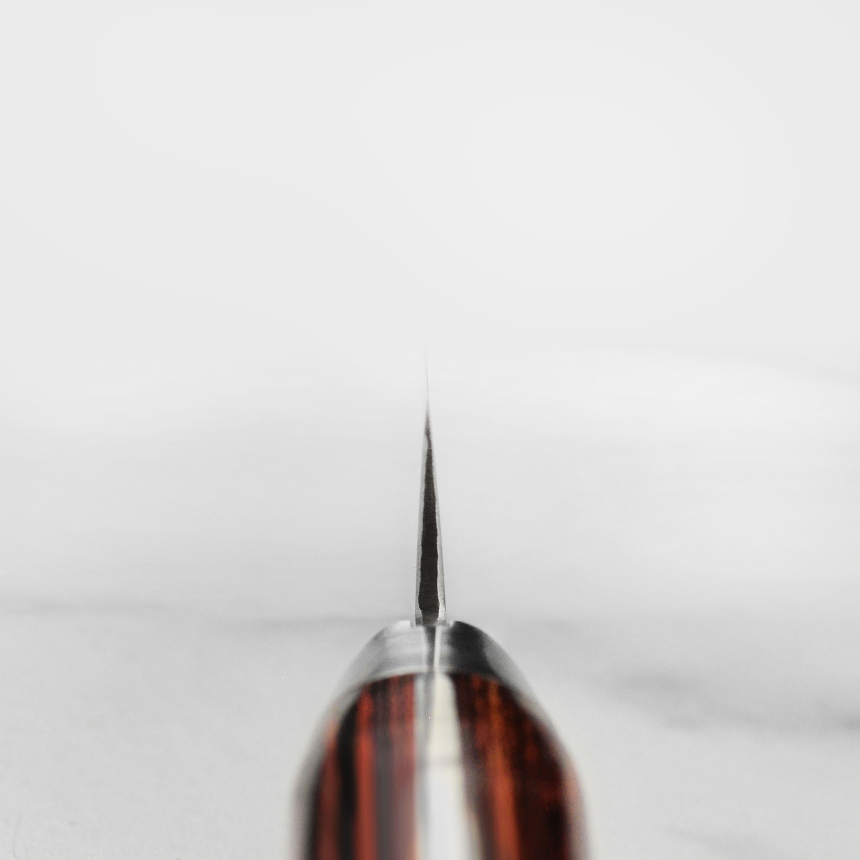 Senzo Clad AUS10 boning knife with sharp blade and Pakkawood handle for precise butchering