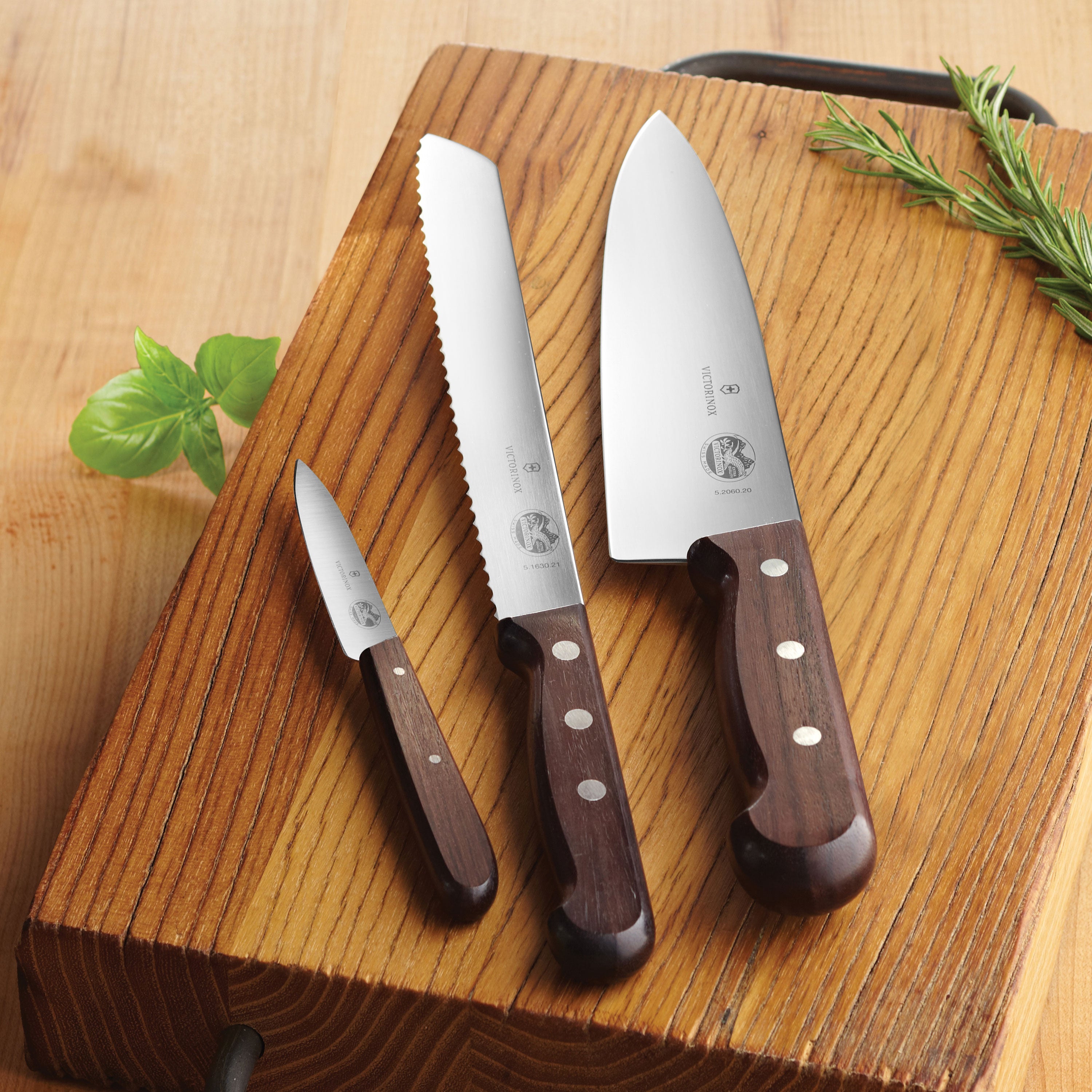 Chef using the Swiss Precision Wood Knife Set for slicing vegetables in a modern kitchen.
