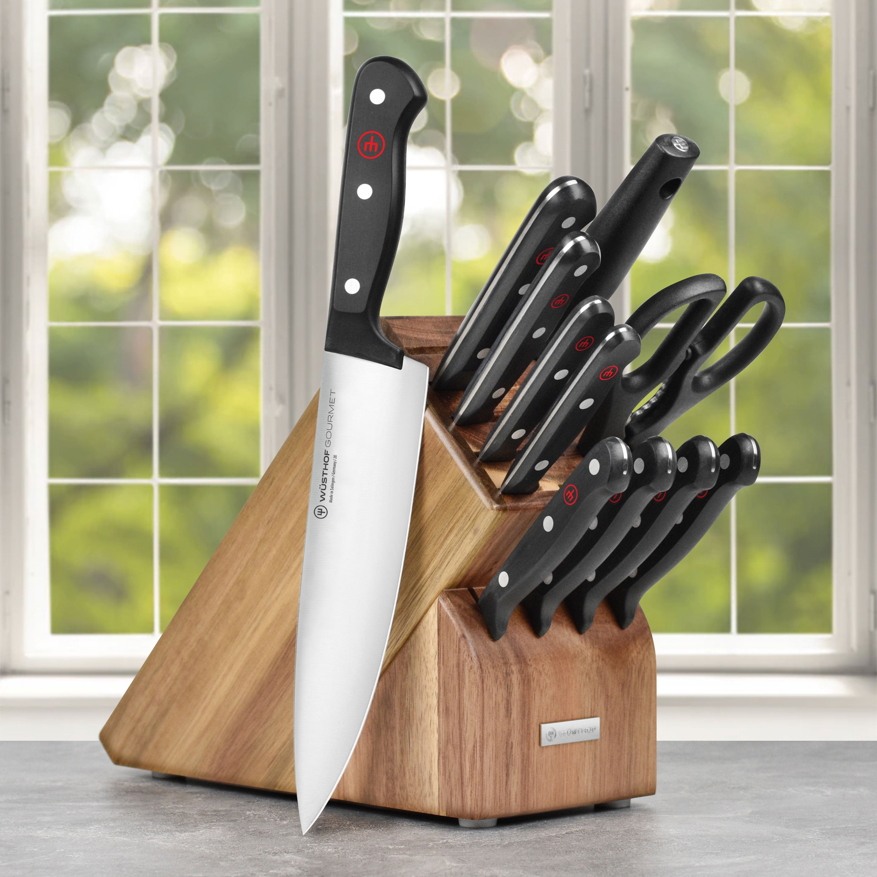 Close-up of Wusthof Gourmet 12-piece knife set showing sharp blades and ergonomic handles