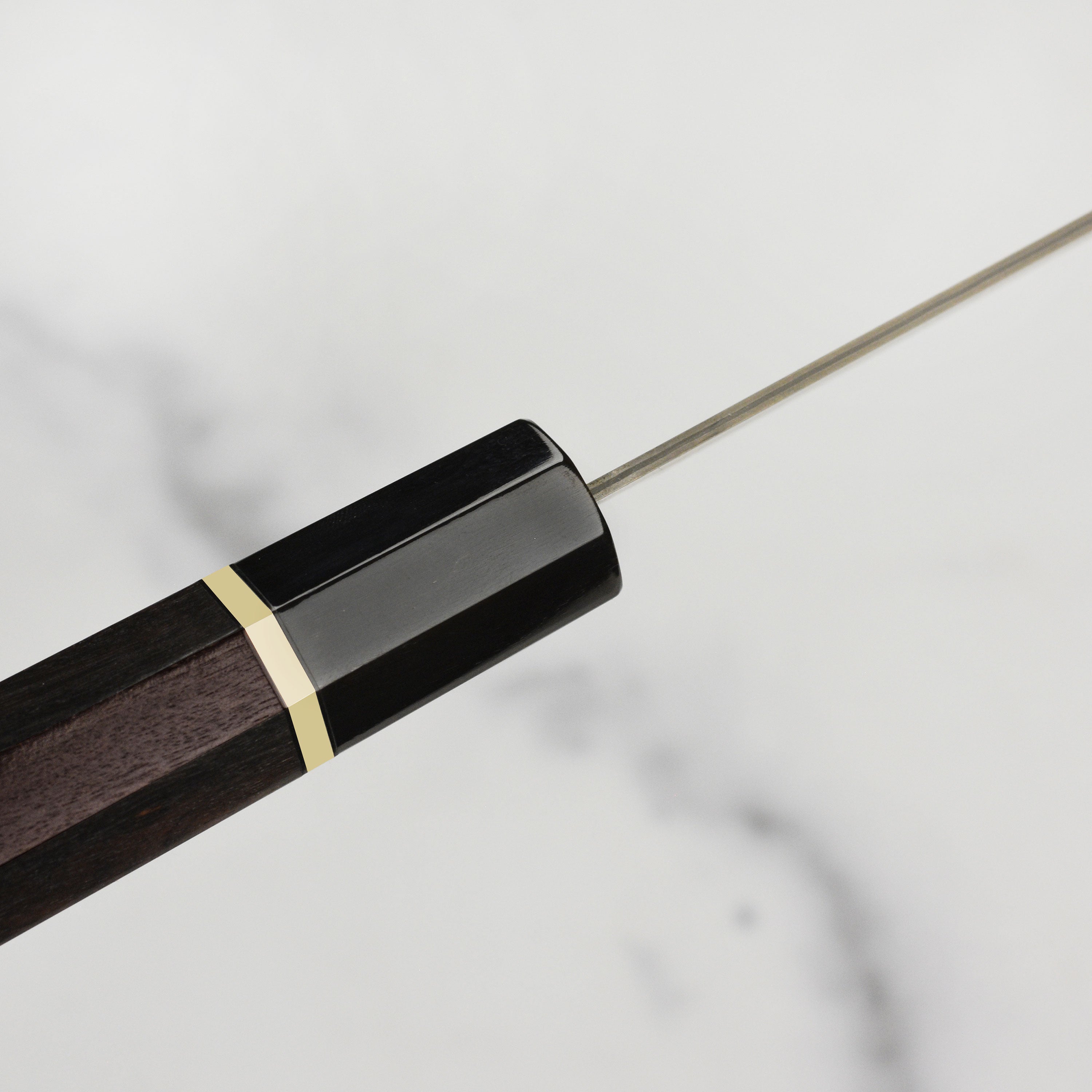 The Saji Black Gold Damascus knife with its wooden gift box, perfect for presentation or gifting.