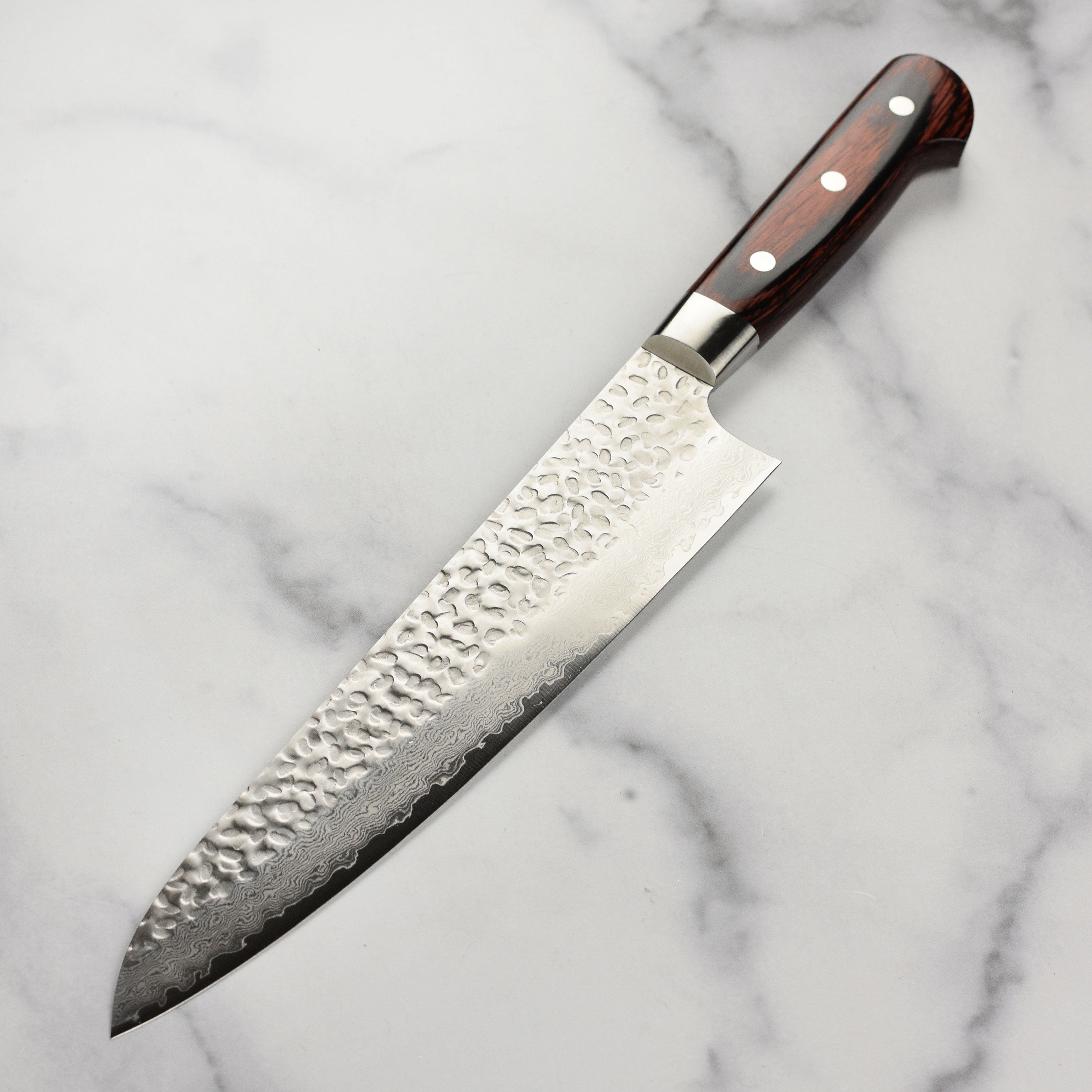 Japanese handmade Damascus knife with full-tang construction and stainless steel rivets
