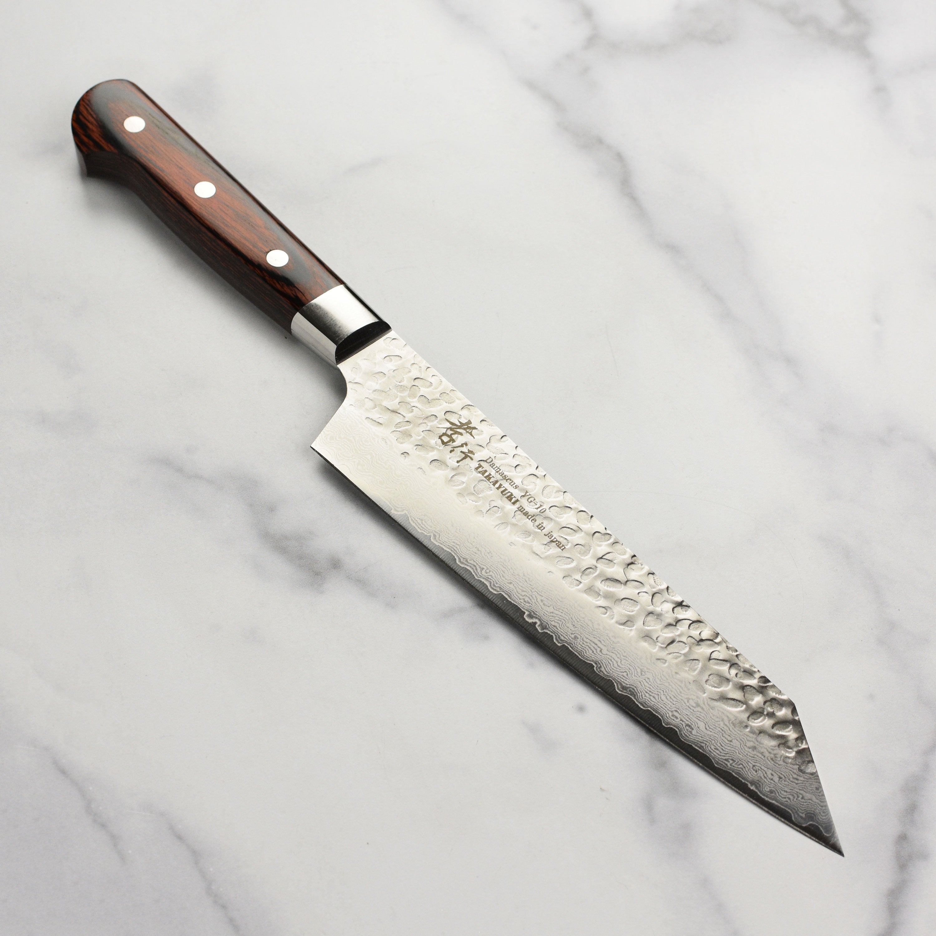 Hammered Damascus blade on Takayuki Bunka knife with detailed craftsmanship