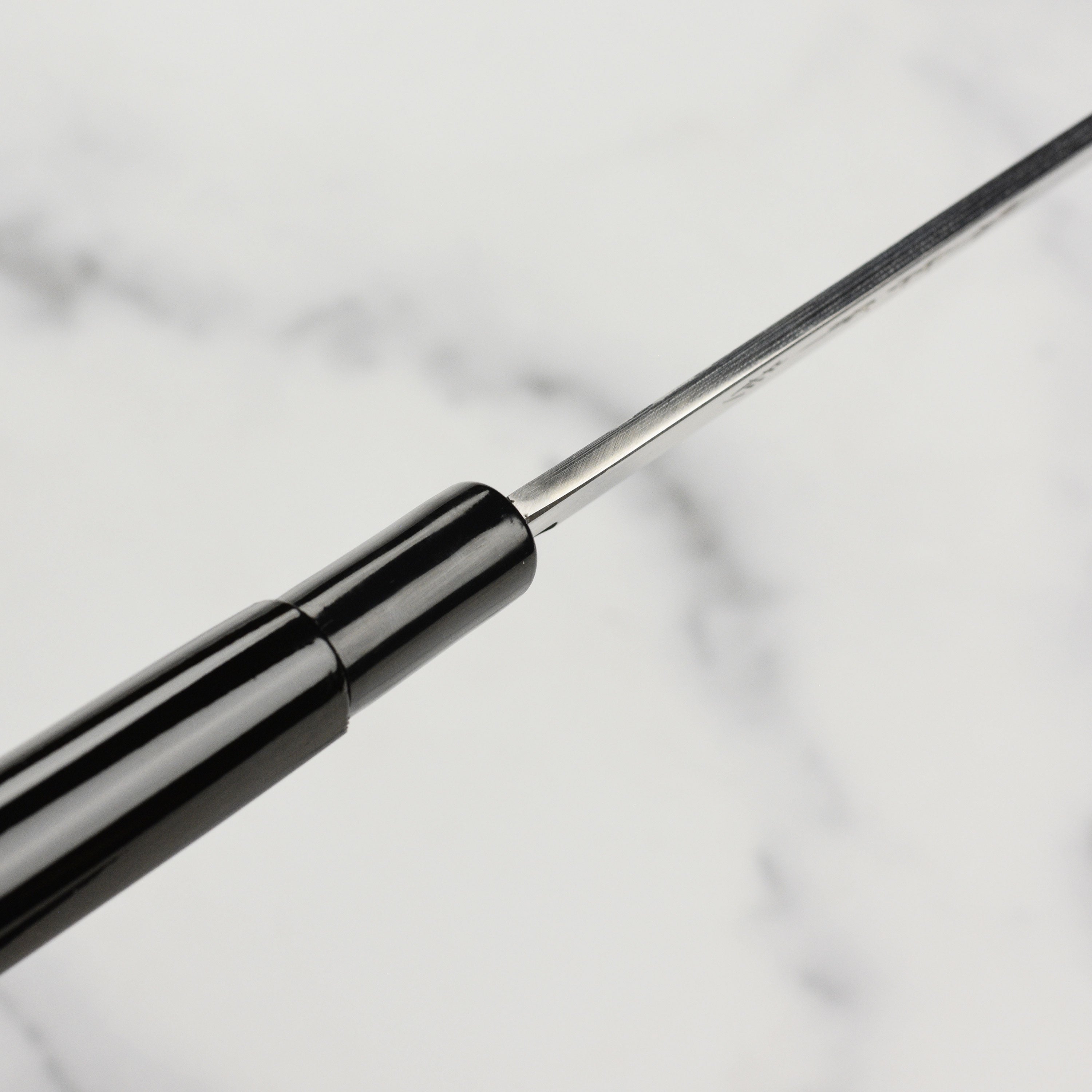 Shikisai Yanagiba knife with saya, showcasing the carbon steel blade and magnolia handle.