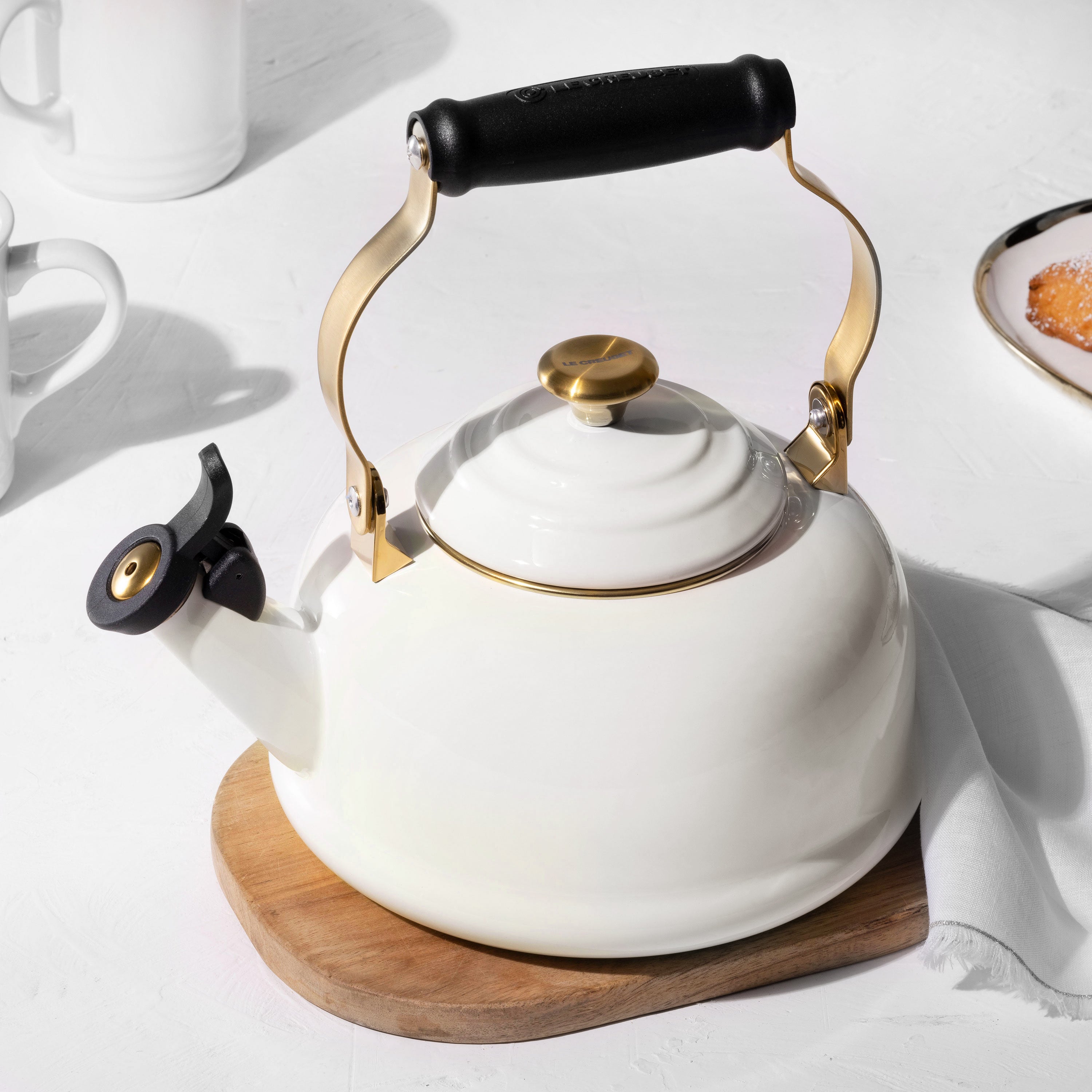 Close-up of the whistling kettle spout, highlighting the easy-open feature for pouring.