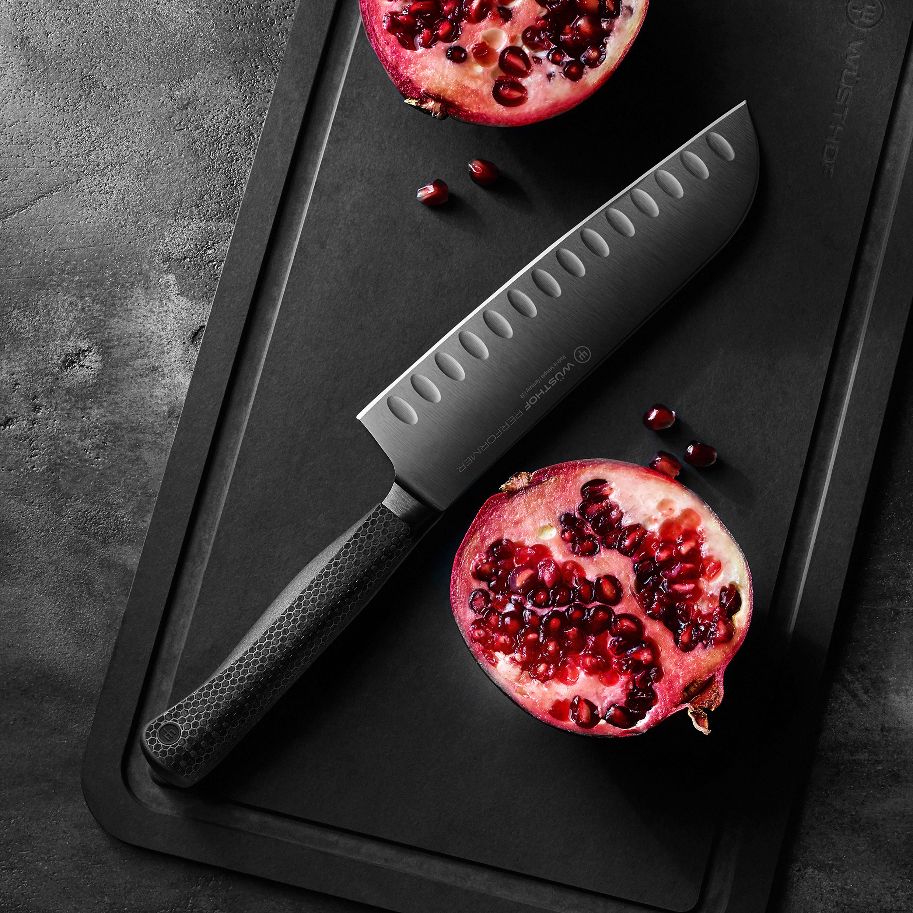 Chef using Wusthof knives for slicing vegetables in a well-lit kitchen