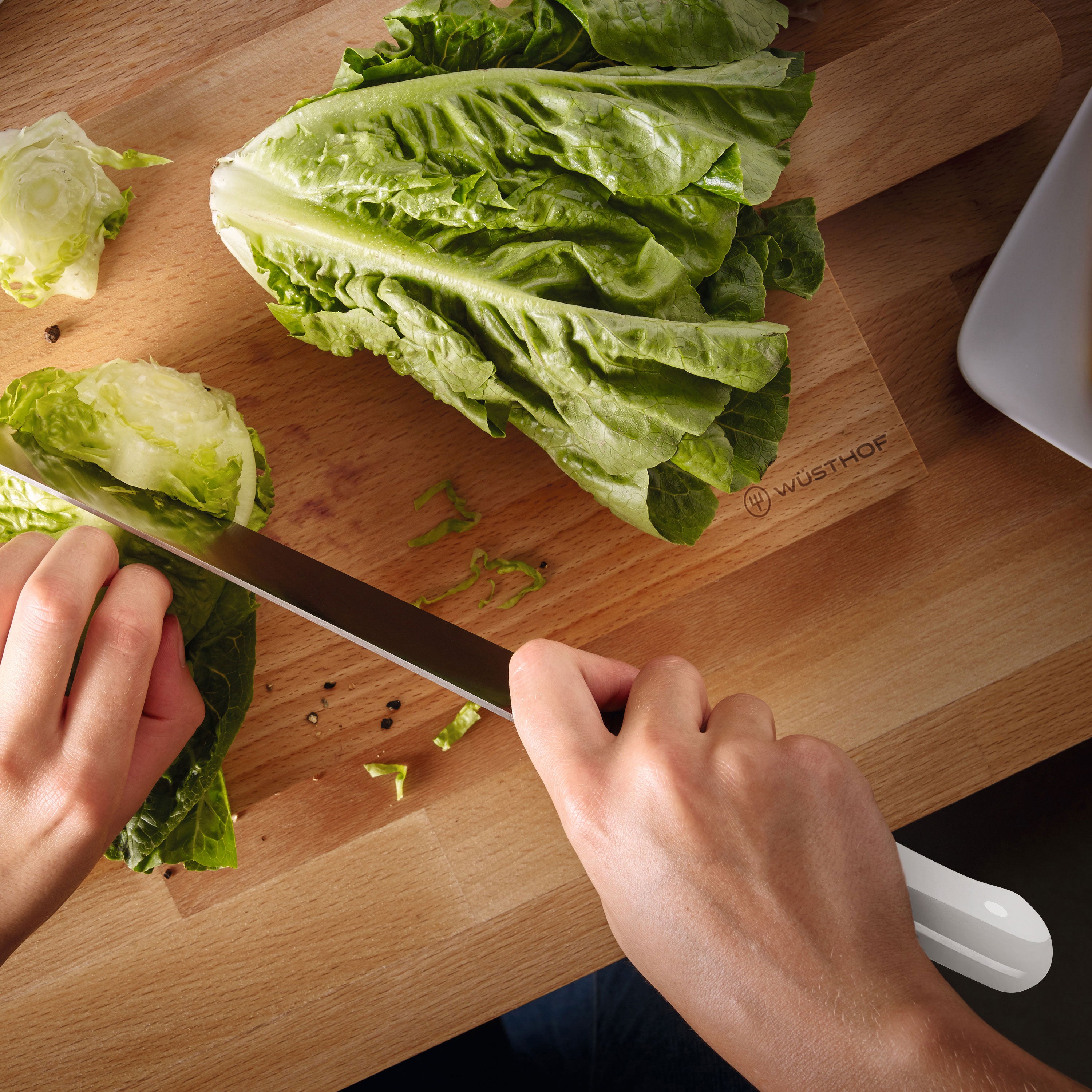 Close-up of chef knives from the Wusthof Gourmet set showing sharp blades and ergonomic handles