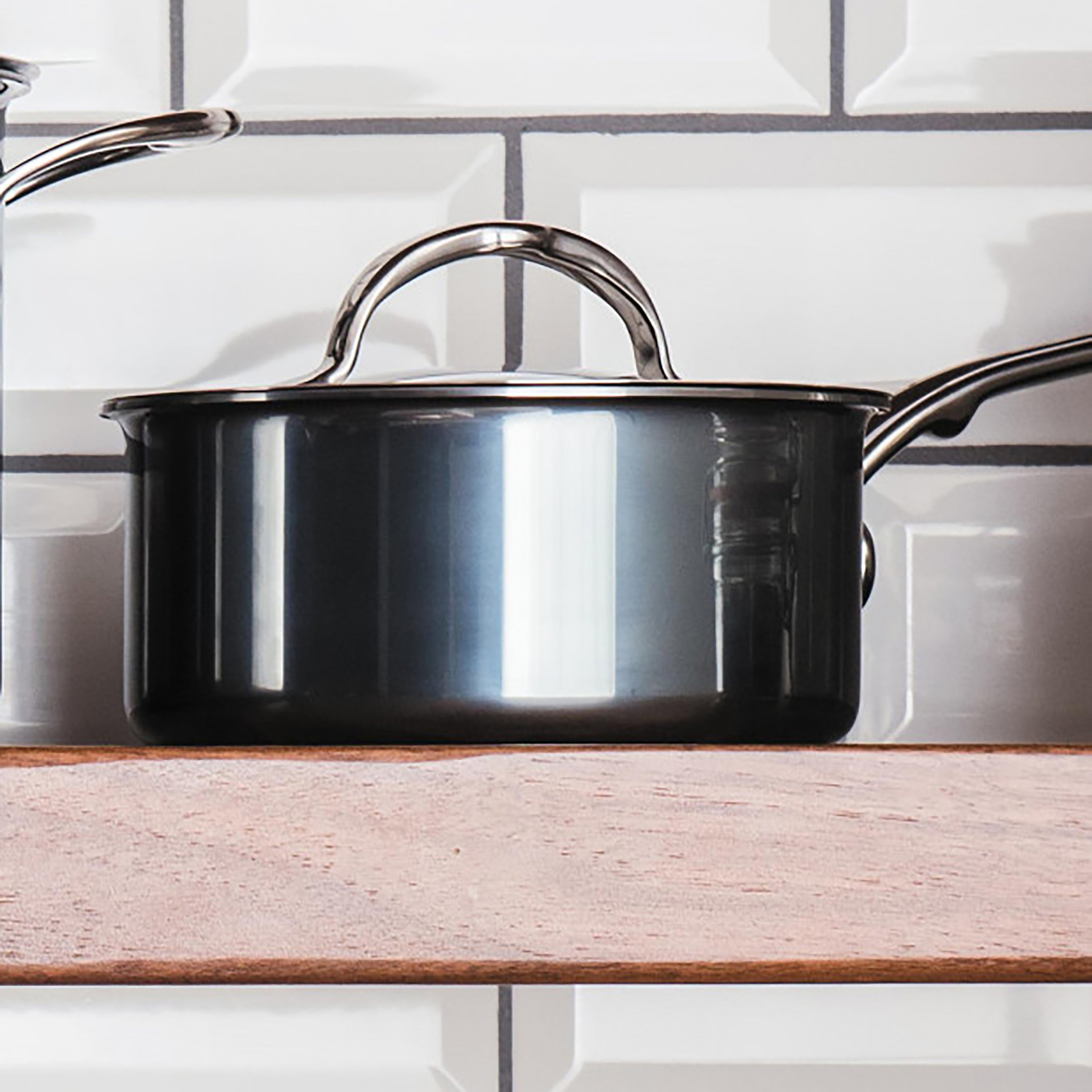Close-up of the Hestan 8.5" stainless steel skillet lid showcasing its heavy-duty design.