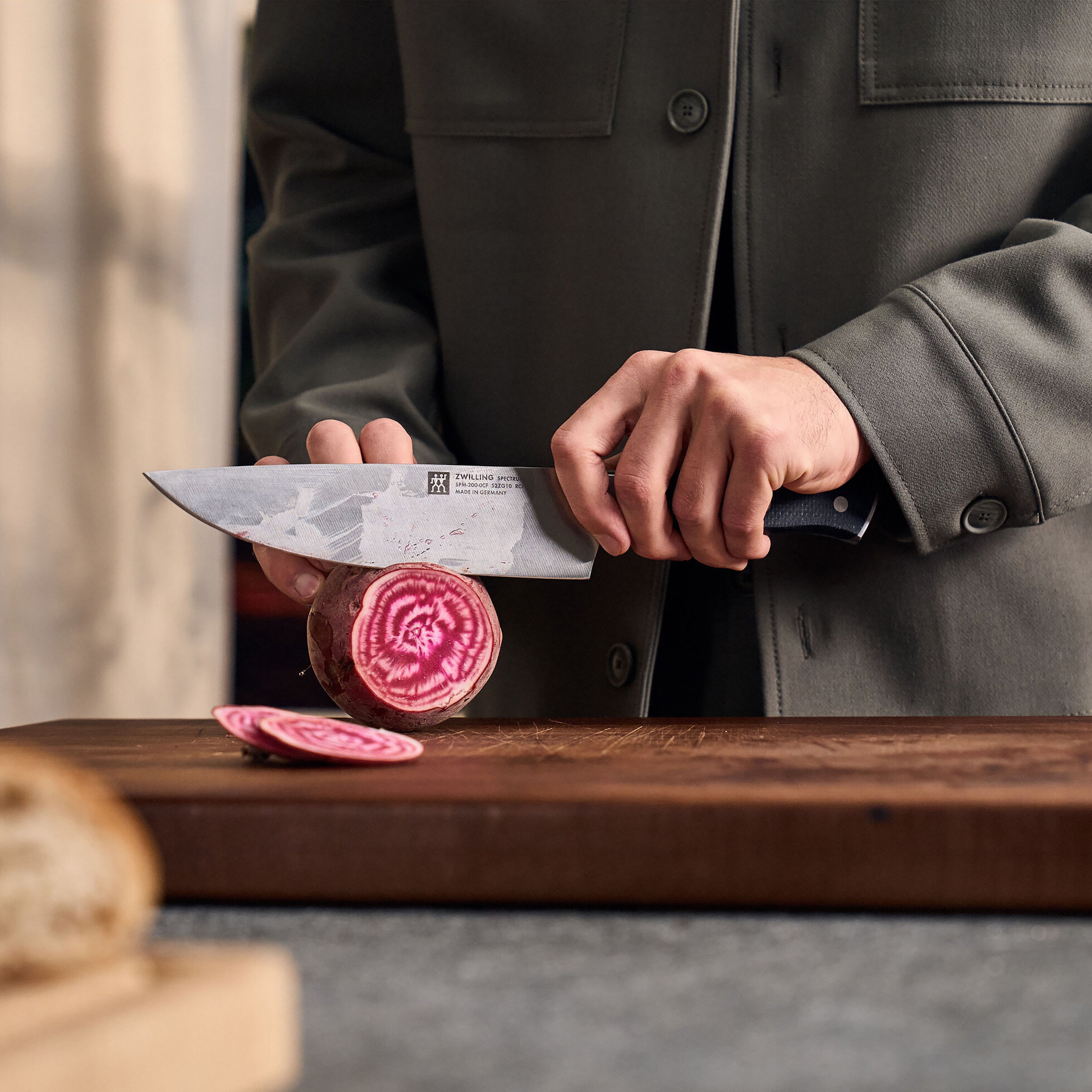 Chef using the Zwilling Spectrum knife for slicing vegetables with ease