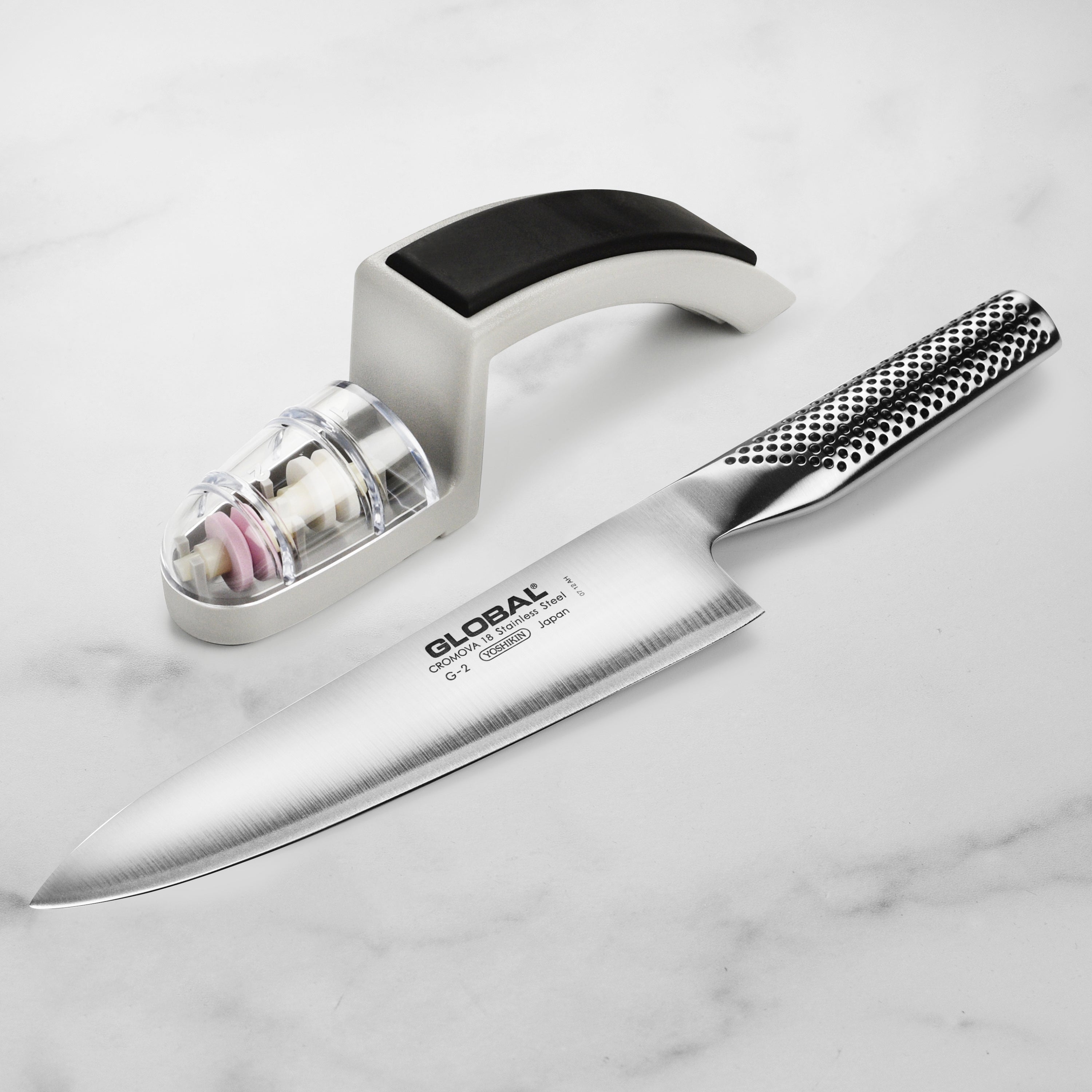 Close-up of the Japanese chef knife blade showing razor-sharp double bevel edge