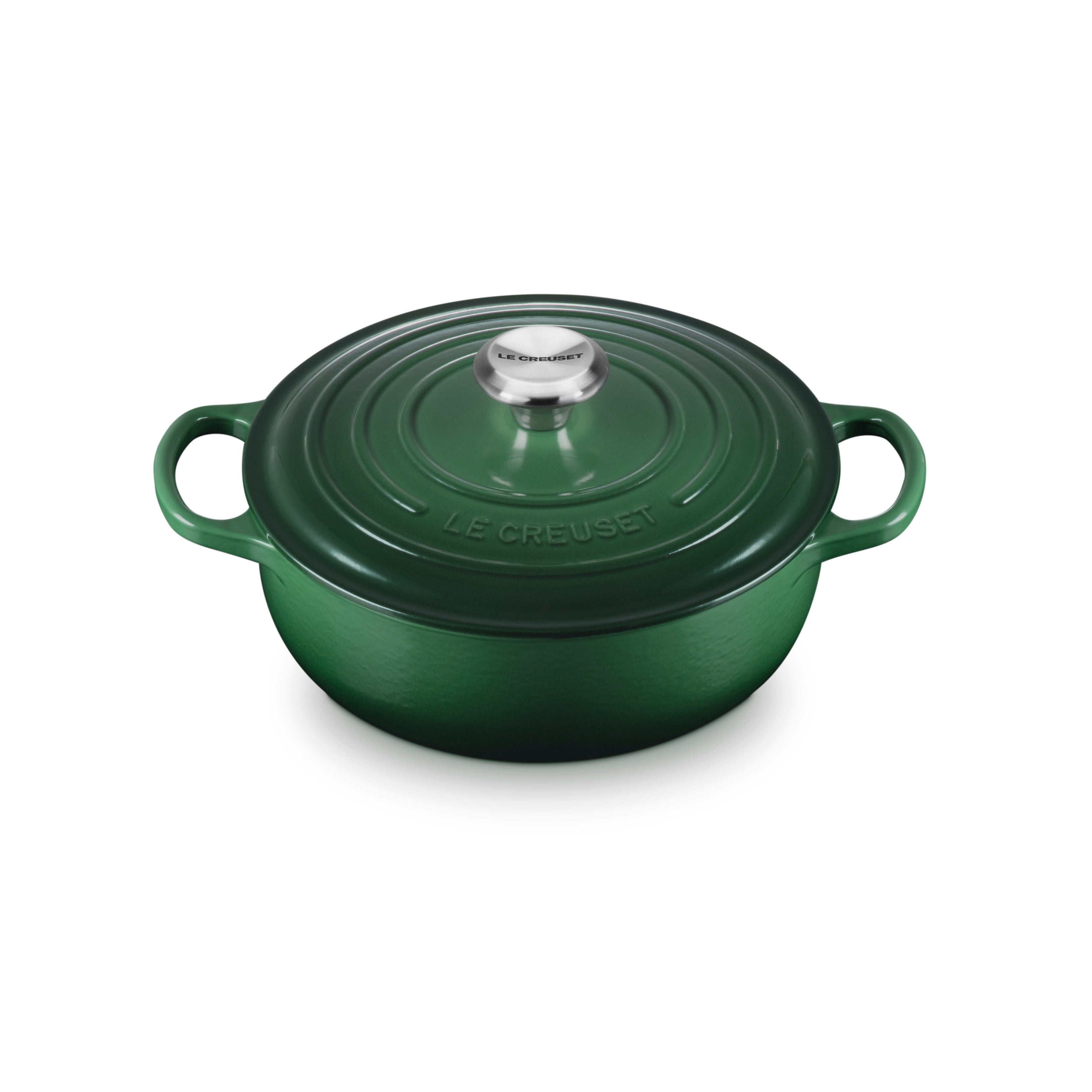 Le Creuset cast iron Dutch oven with enamel finish on a stovetop, showcasing its durable design