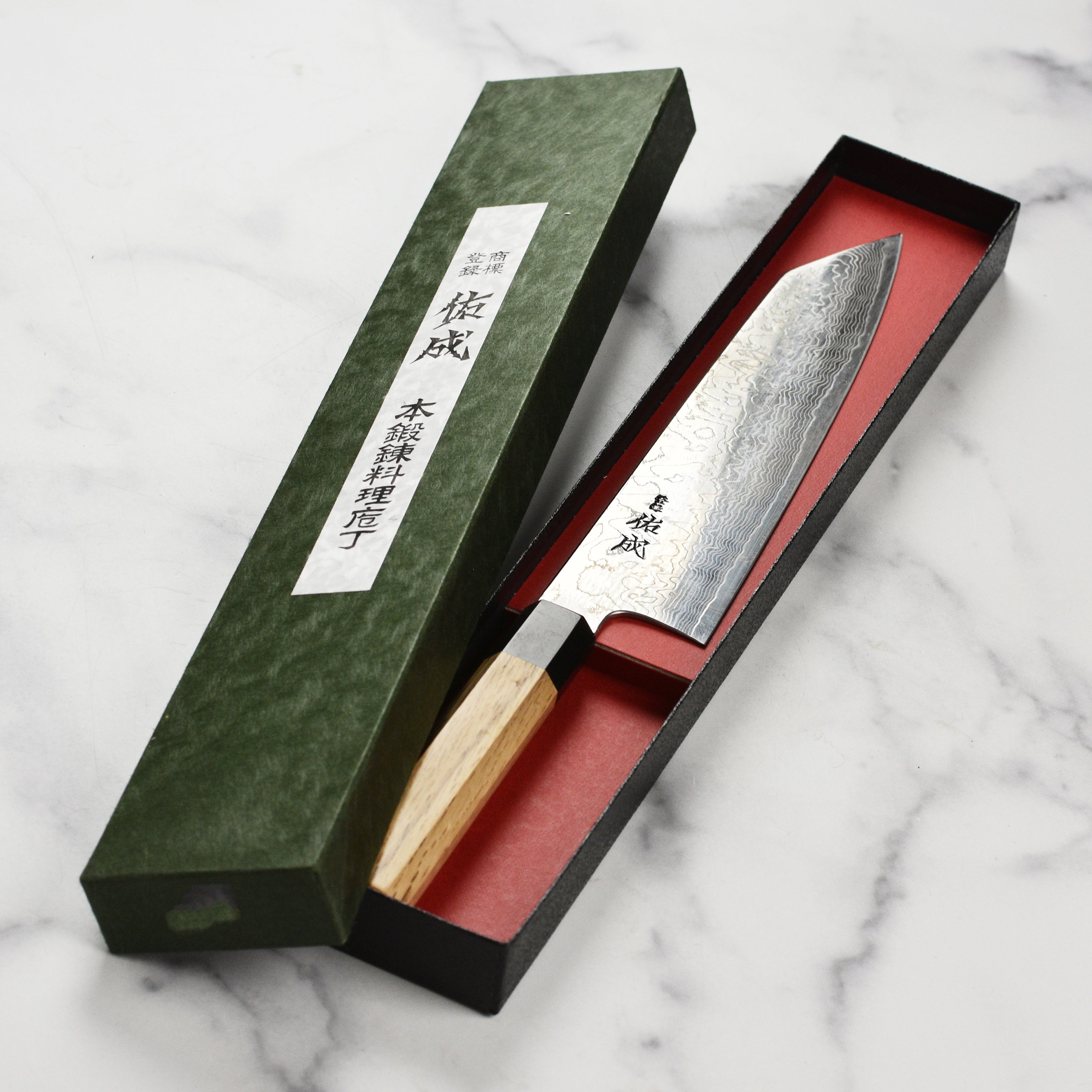 Sukenari SG2 Kiritsuke in a kitchen setting, highlighting its sleek appearance.