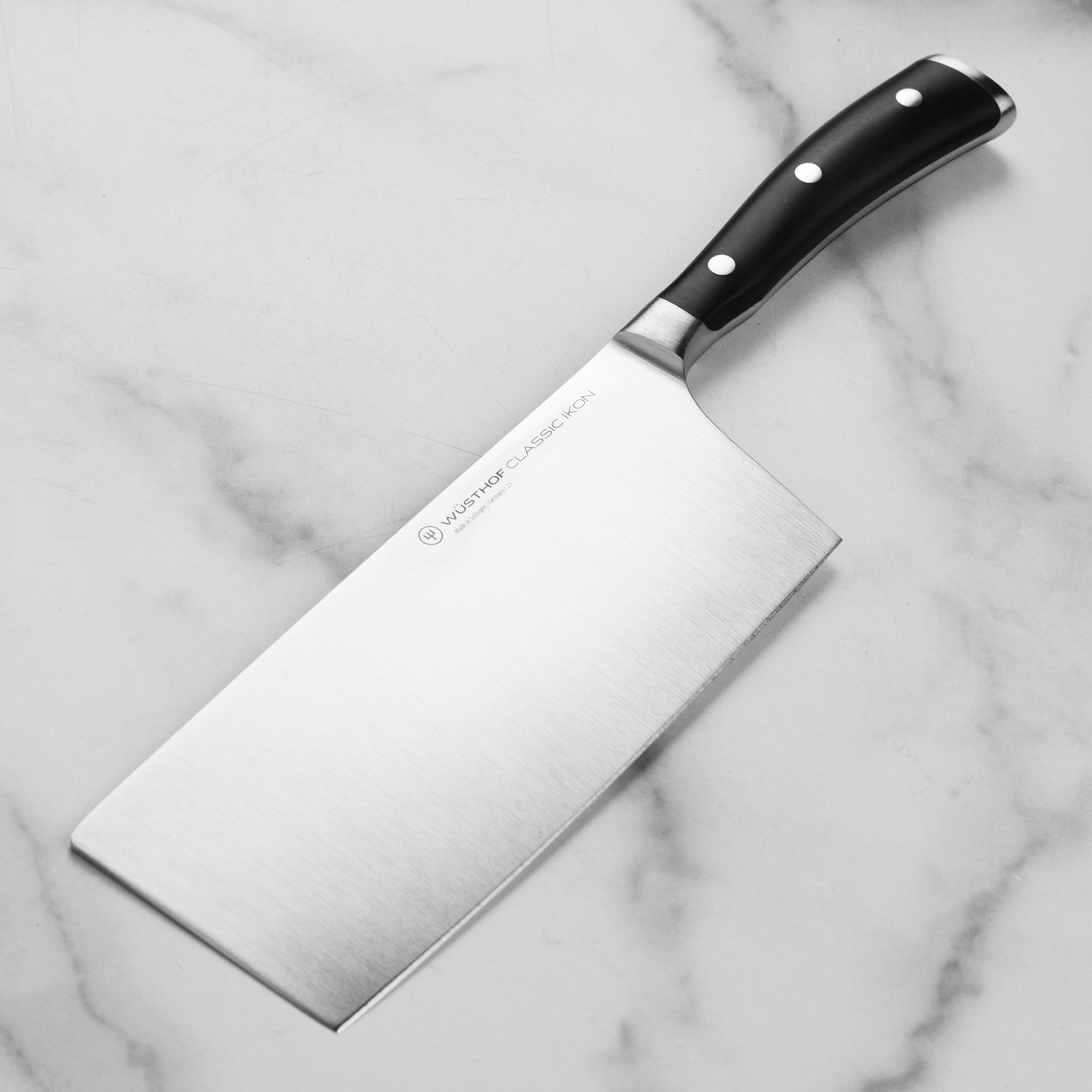 Wusthof 7 Inch Chinese chef's knife with full tang and ergonomic handle for precise cuts.