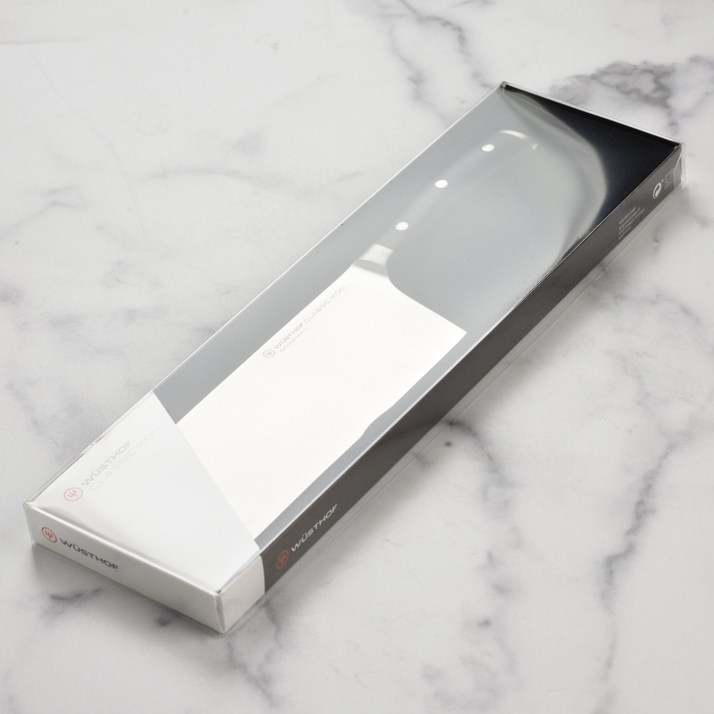Professional kitchen setting showing the Wusthof 7 inch Chinese chefs knife in action.