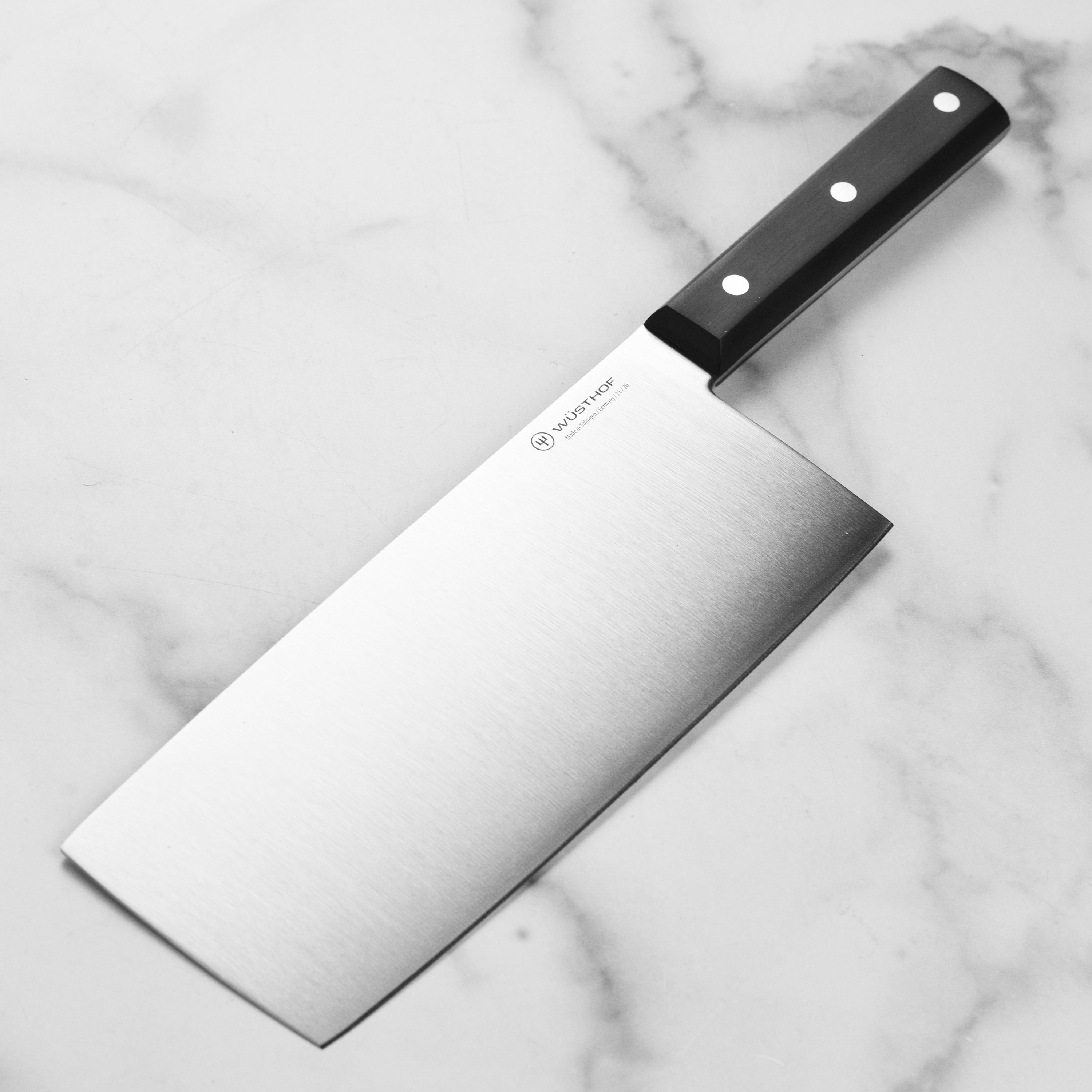 Wusthof 8-Inch Chef's Knife showcasing its sharp edge and polished finish from above.