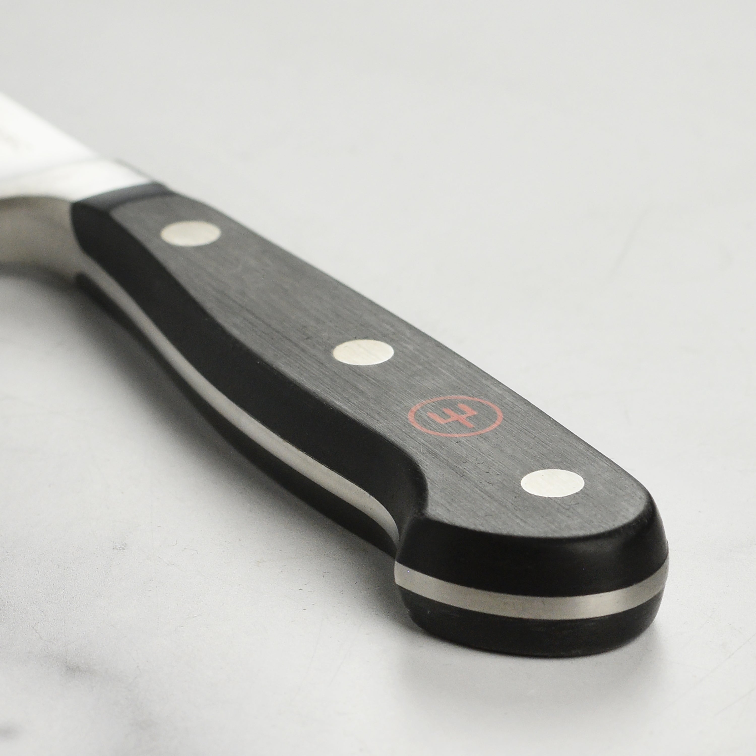 Chef using the premium German kitchen knife for slicing vegetables
