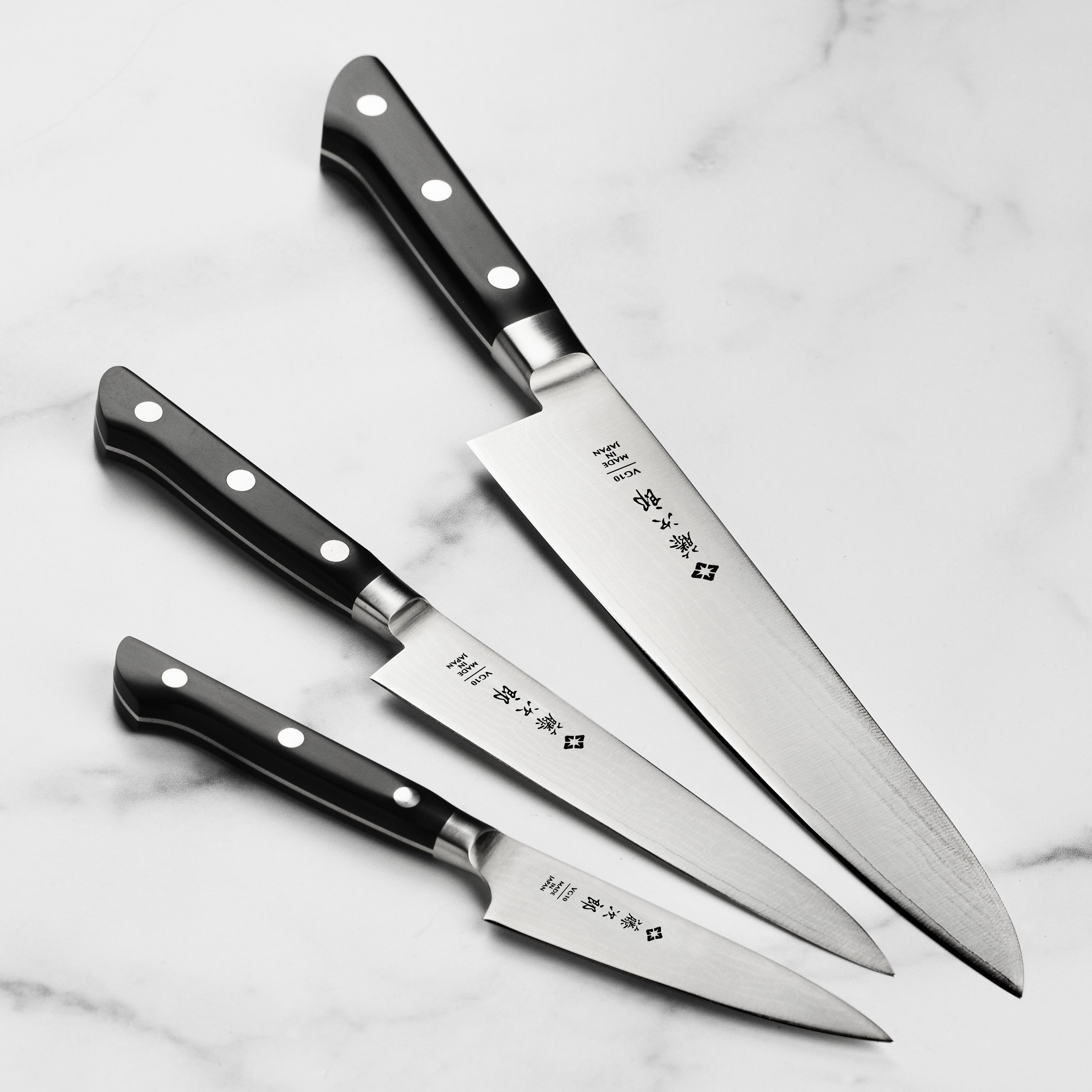 Tojiro Damascus knife set side view with micarta handle