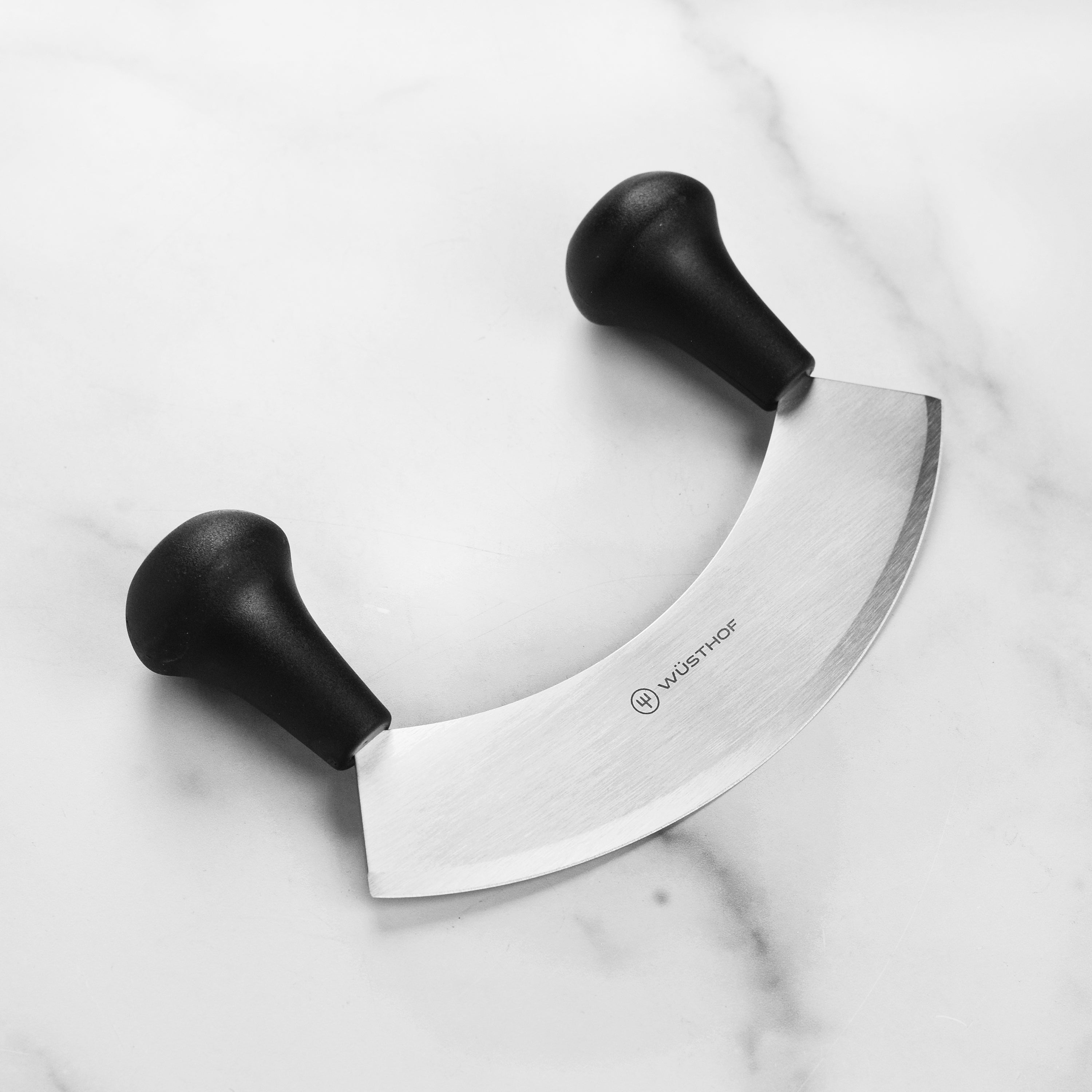 Close-up of the Wusthof Elite 7-Inch Mincing Knife blade highlighting its sharpness and craftsmanship.