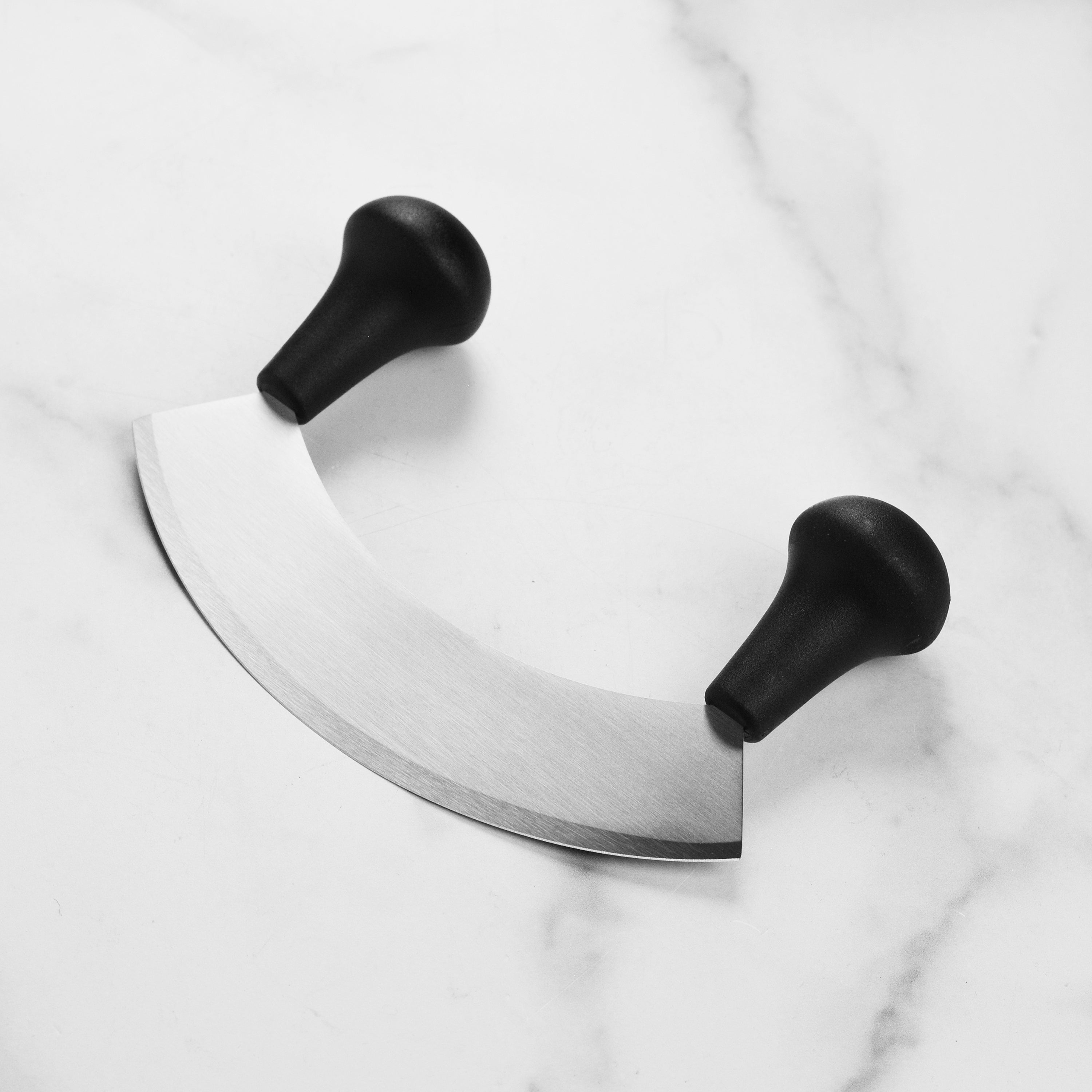 Close-up of the Wusthof Elite 7-Inch Mincing Knife blade highlighting its sharpness and craftsmanship.
