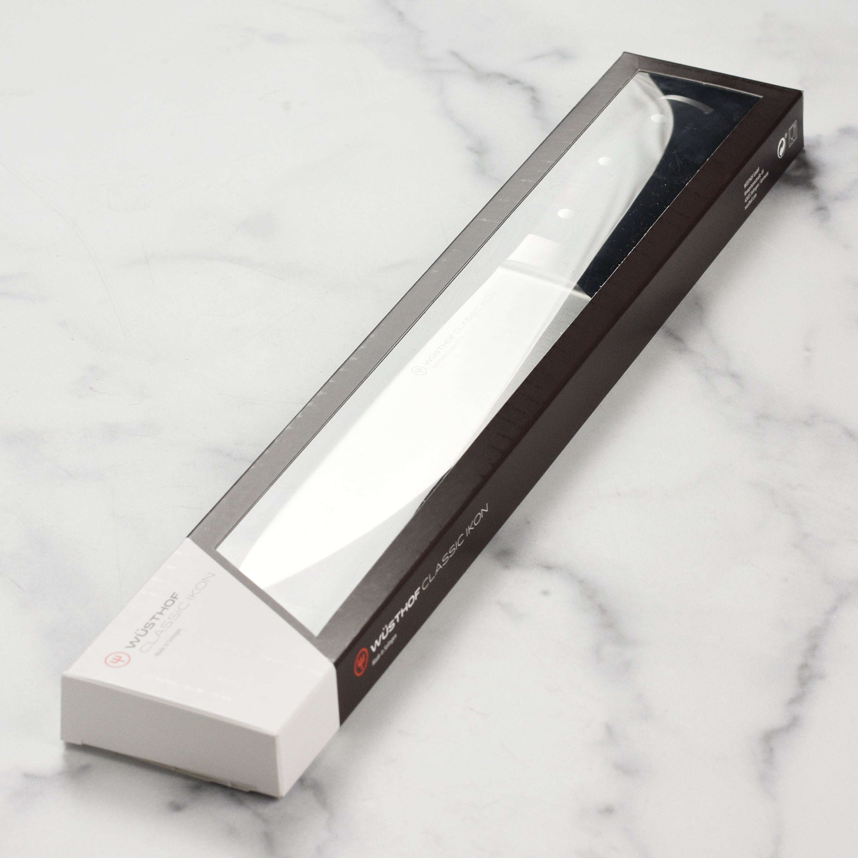 Side profile of Wusthof Classic Ikon 9-inch chef’s knife showing precision edge blade