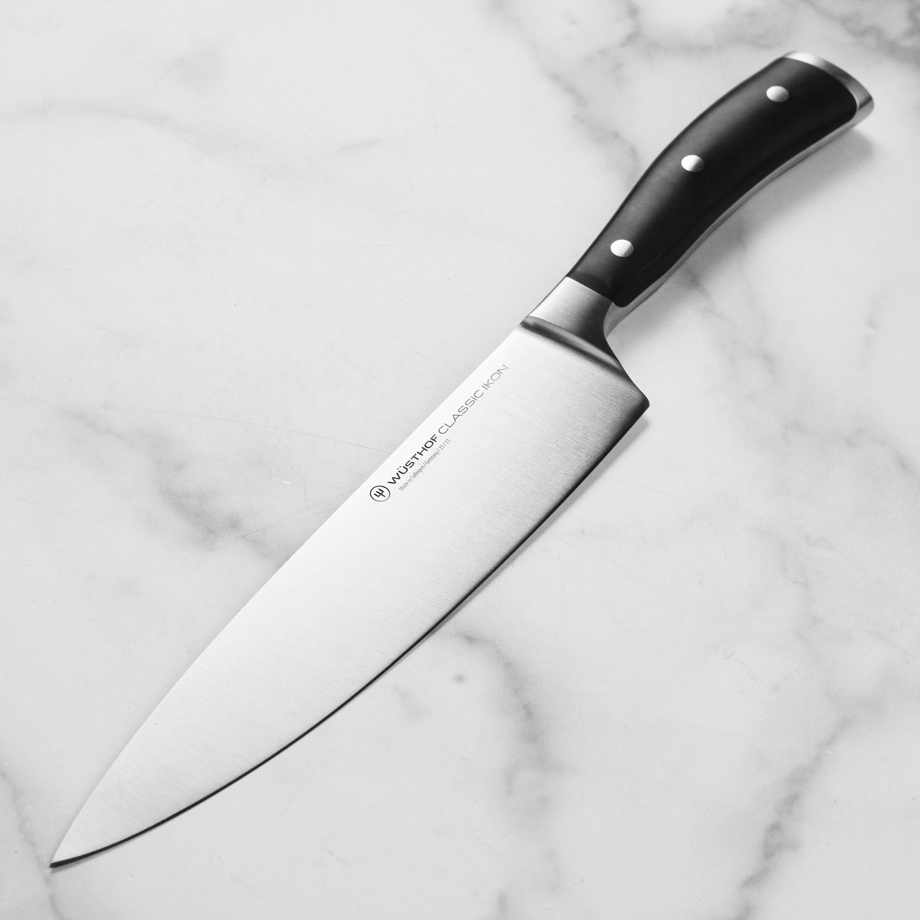 Side profile of Wusthof Classic Ikon 9-inch chef’s knife showing precision edge blade