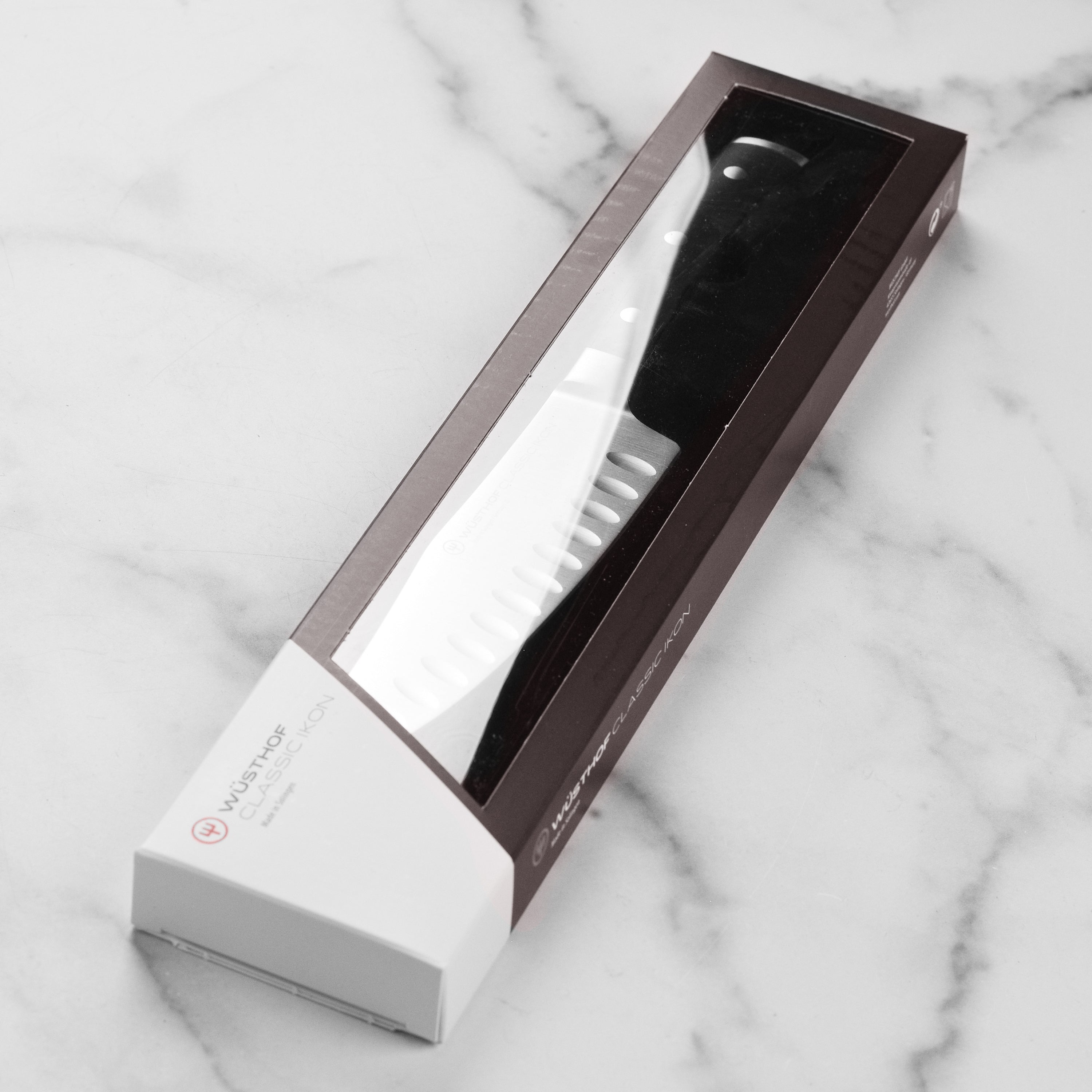 Top view of forged German chef knife highlighting its sharp edge