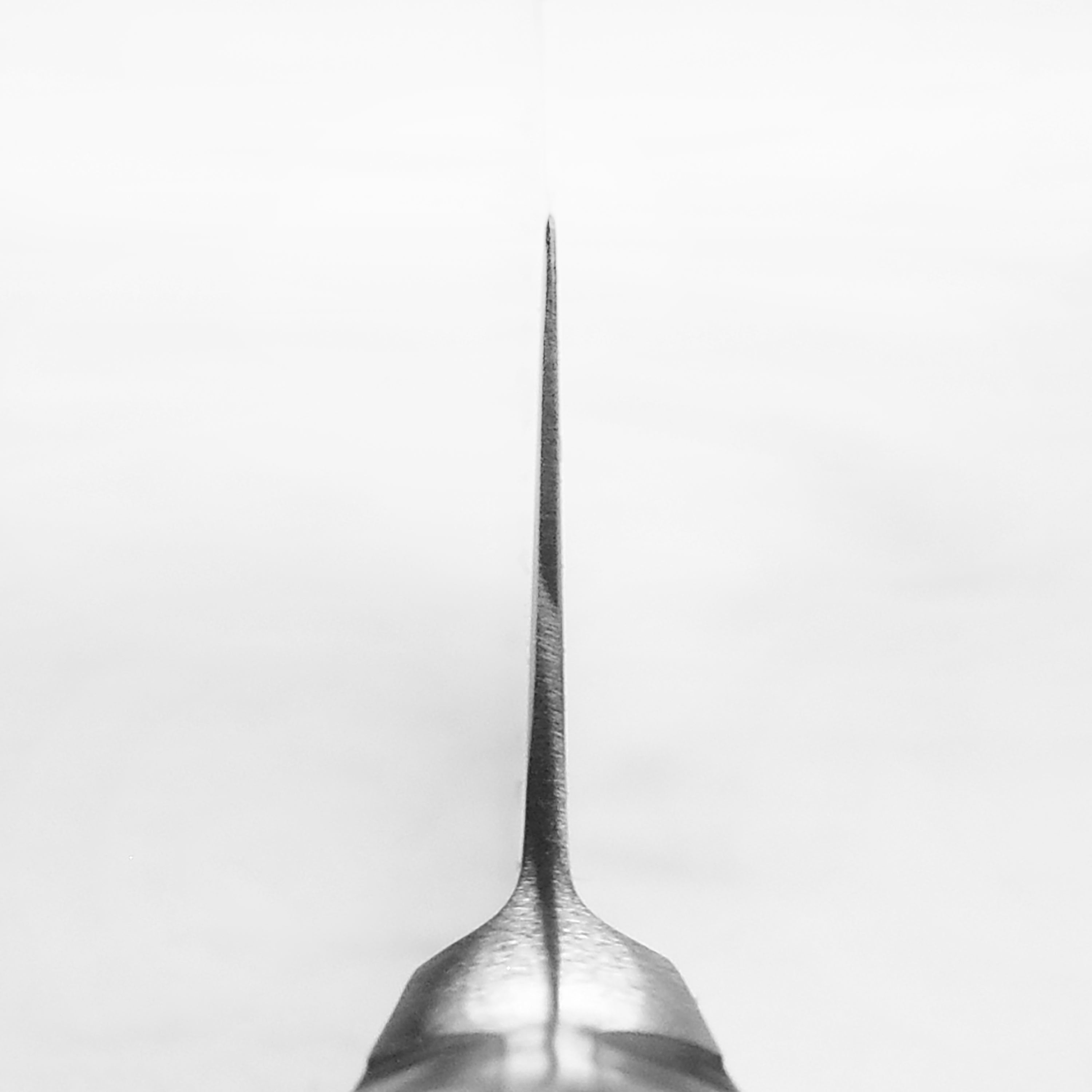 Wusthof Classic 6-Inch Chefs Knife angled view highlighting the sharp blade and ergonomic handle.