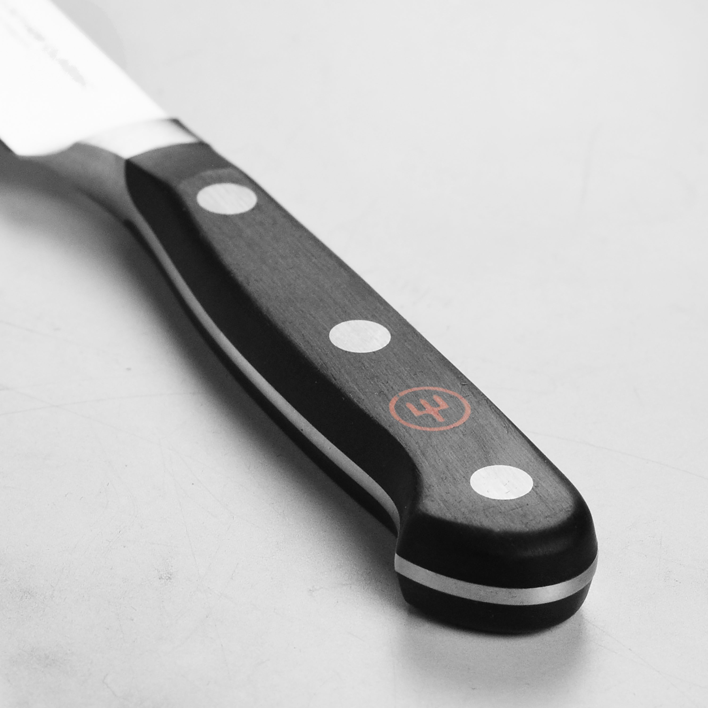 Wusthof Classic paring knife in use, effortlessly peeling fruits with precision.
