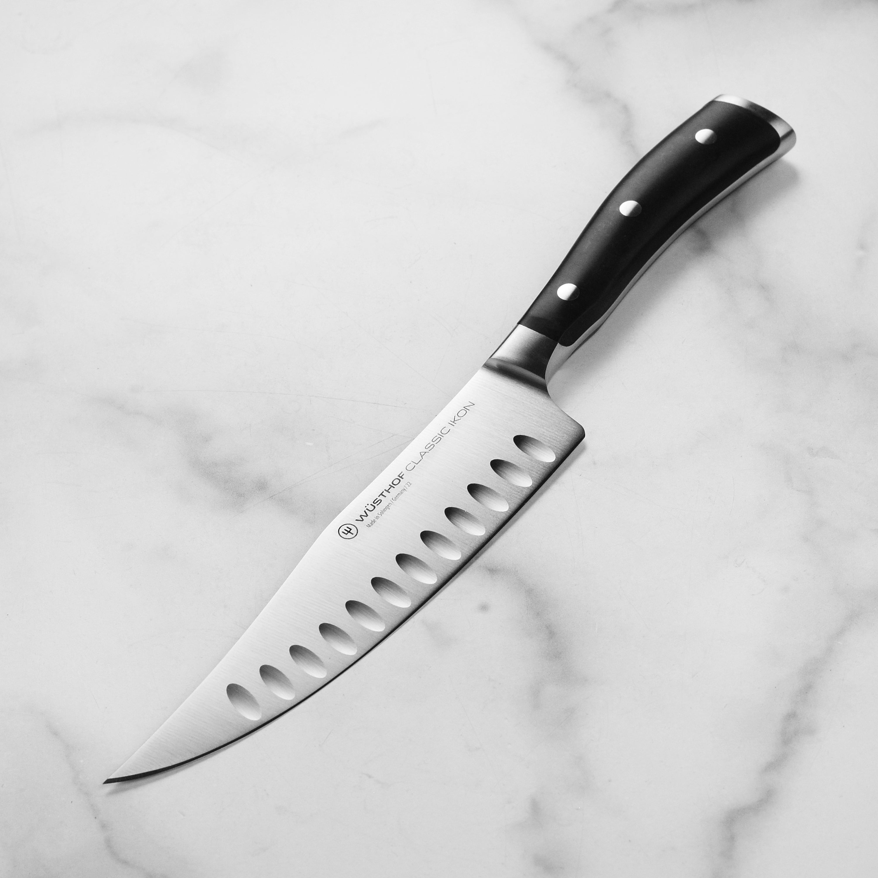 Wusthof classic ikons 7-inch chef knife blade detail for precision slicing