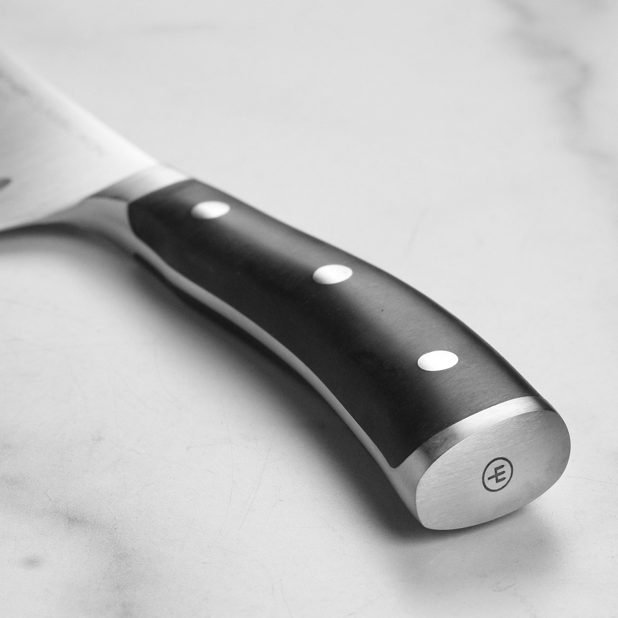 Ergonomic handle of high-carbon stainless steel kitchen knife in use