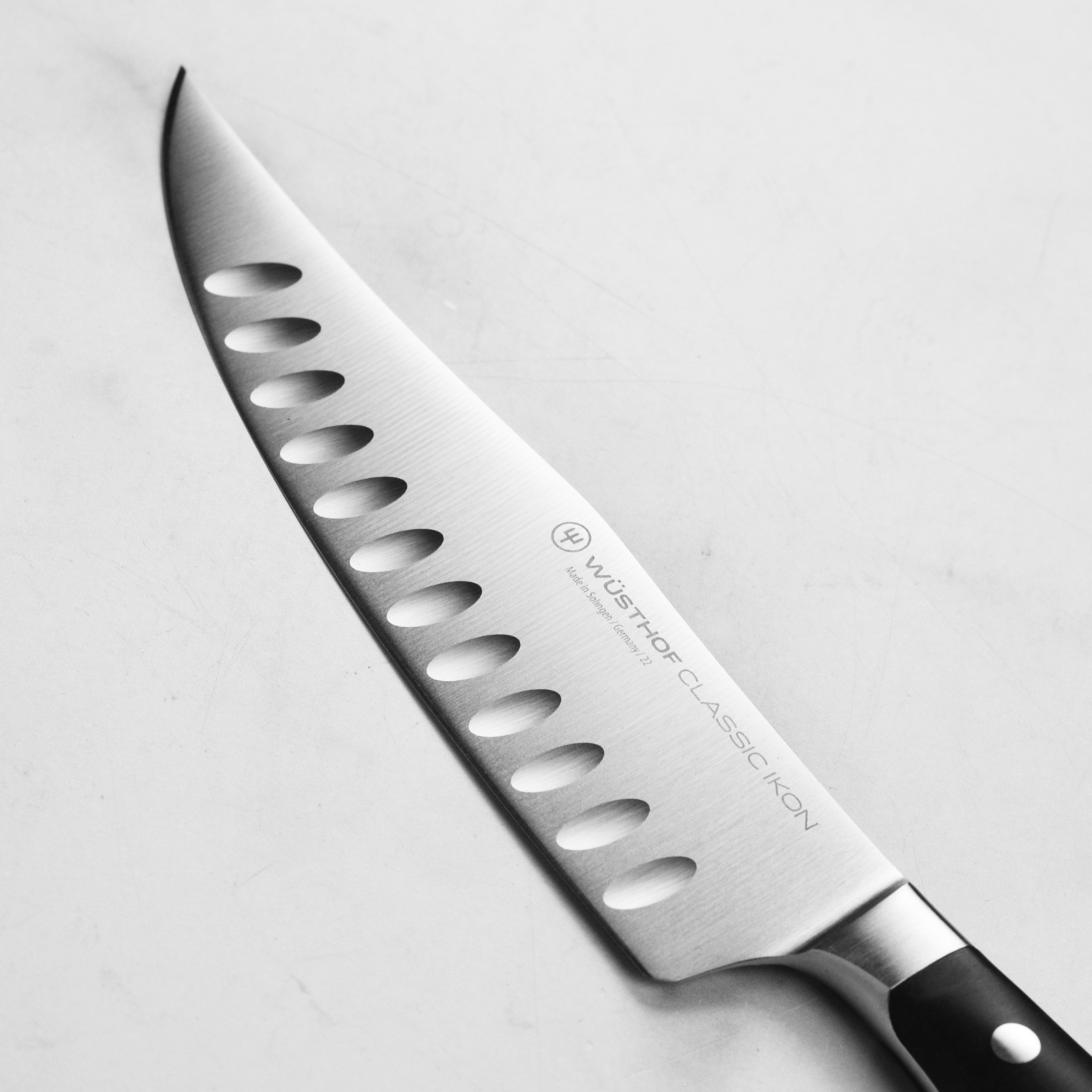 Wusthof classic ikons 7-inch chef knife blade detail for precision slicing