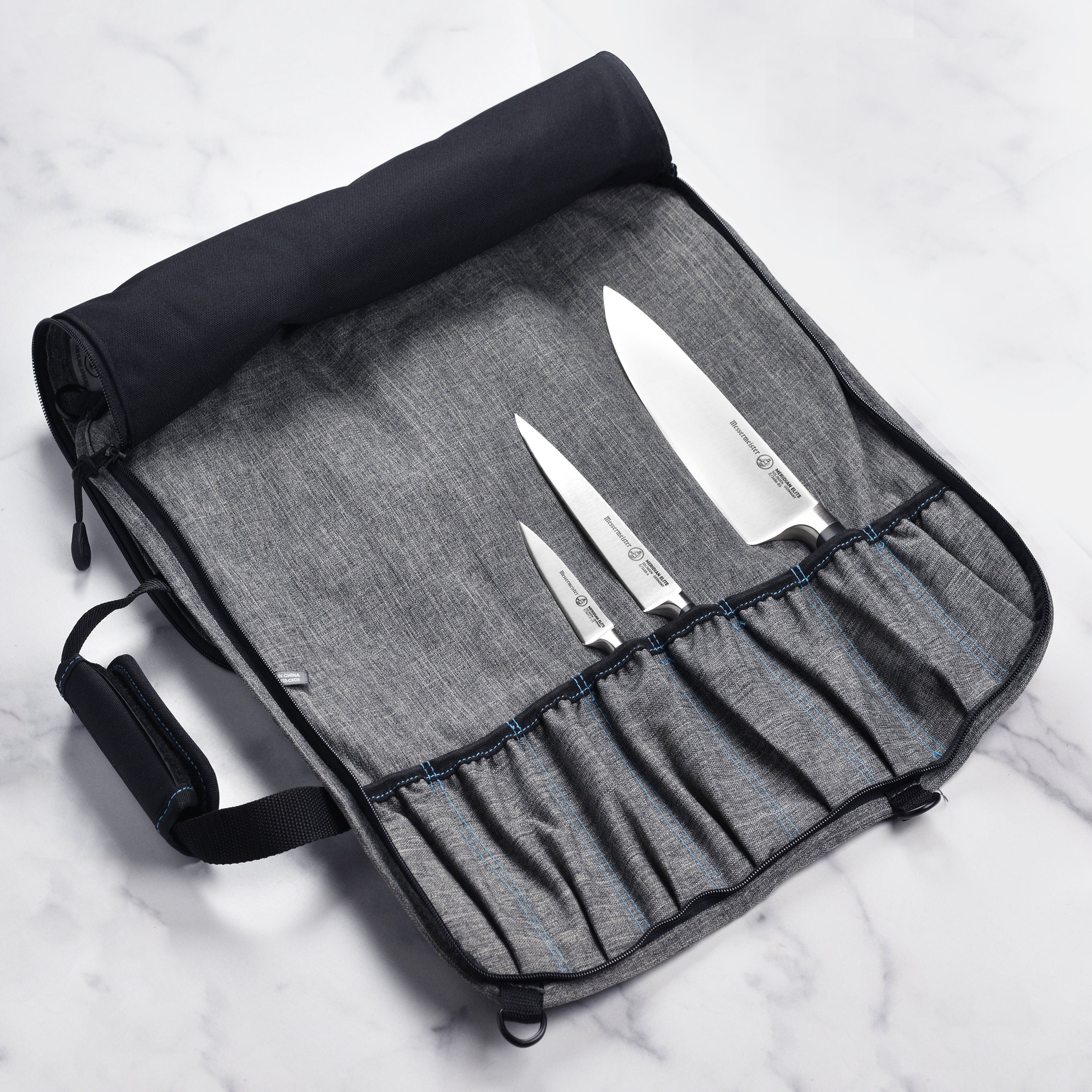 Close-up of the durable YKK zippers on the chef knife roll.