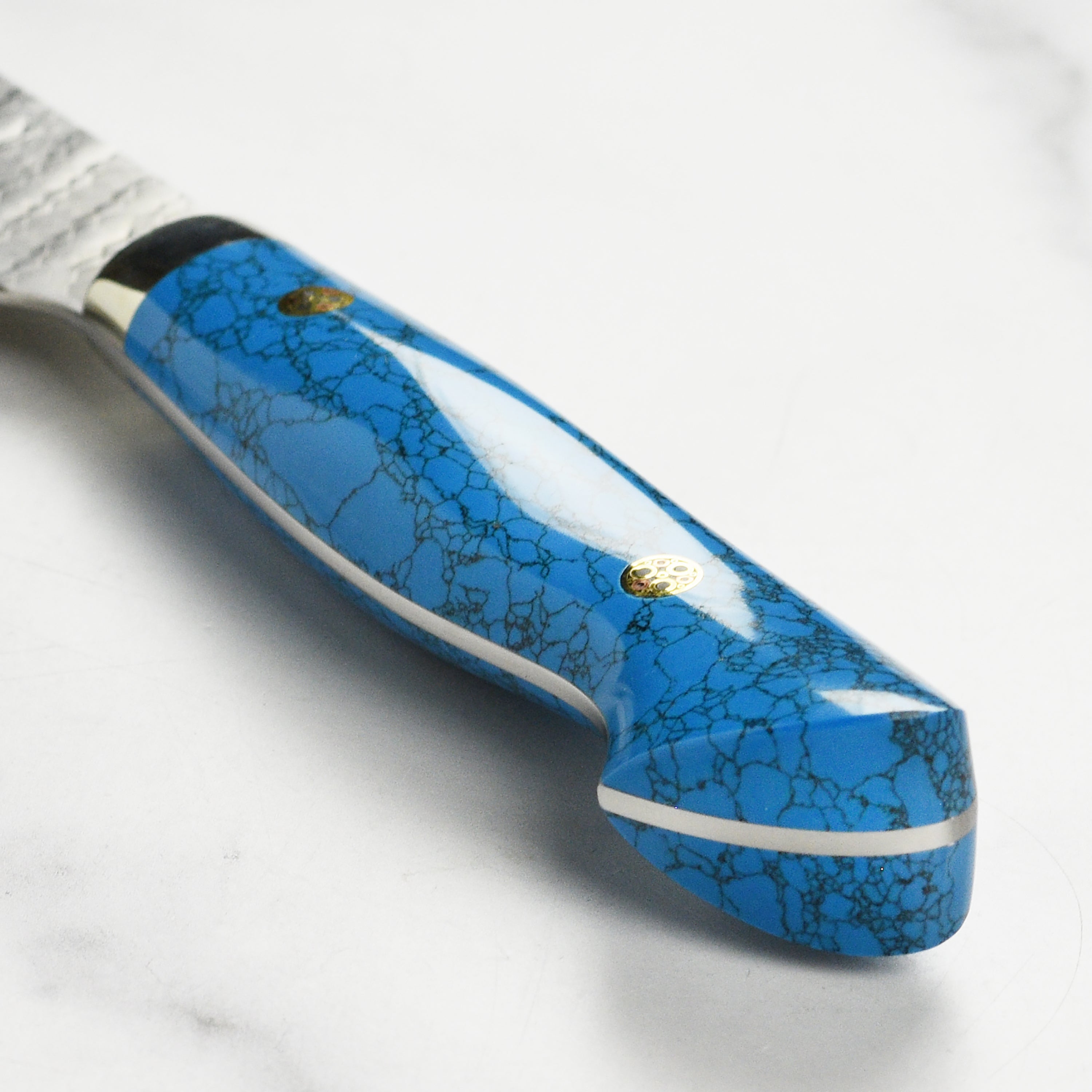 Close-up of the hand-forged Japanese blade of the Nigara SG2 Migaki Tsuchime Bunka Knife