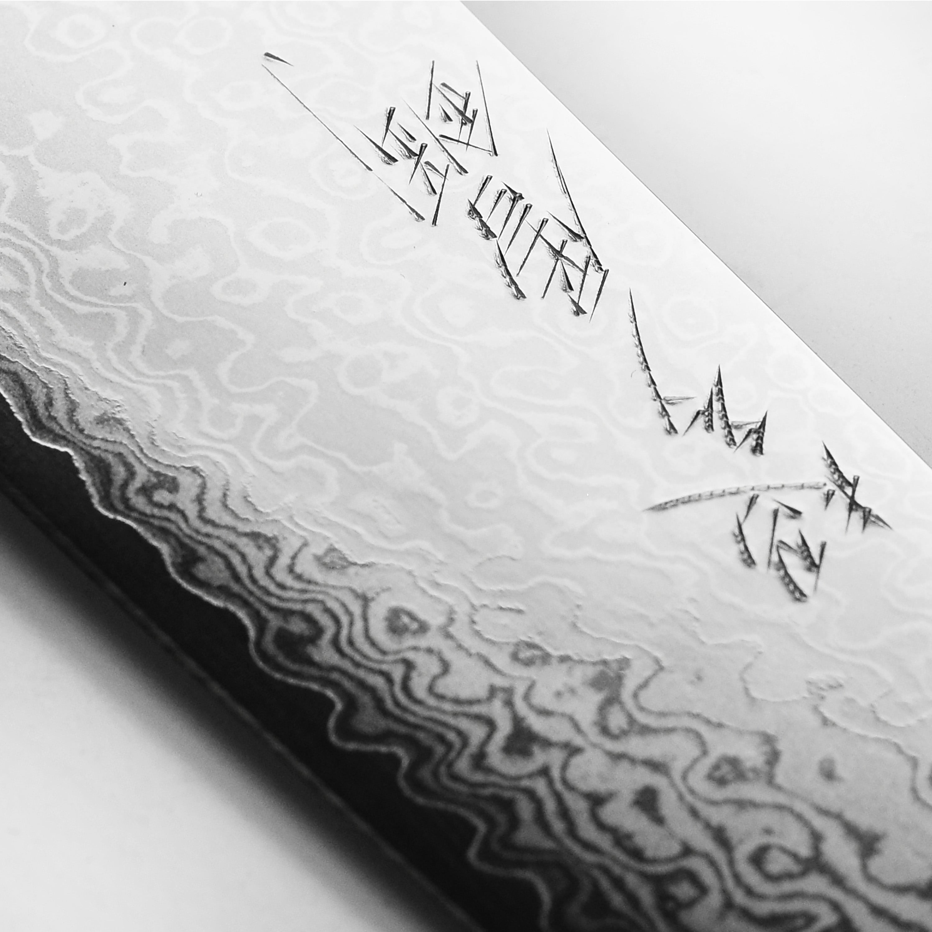 Yaxell Ran Plus 9.5" Damascus Knife in action, slicing through fresh vegetables.