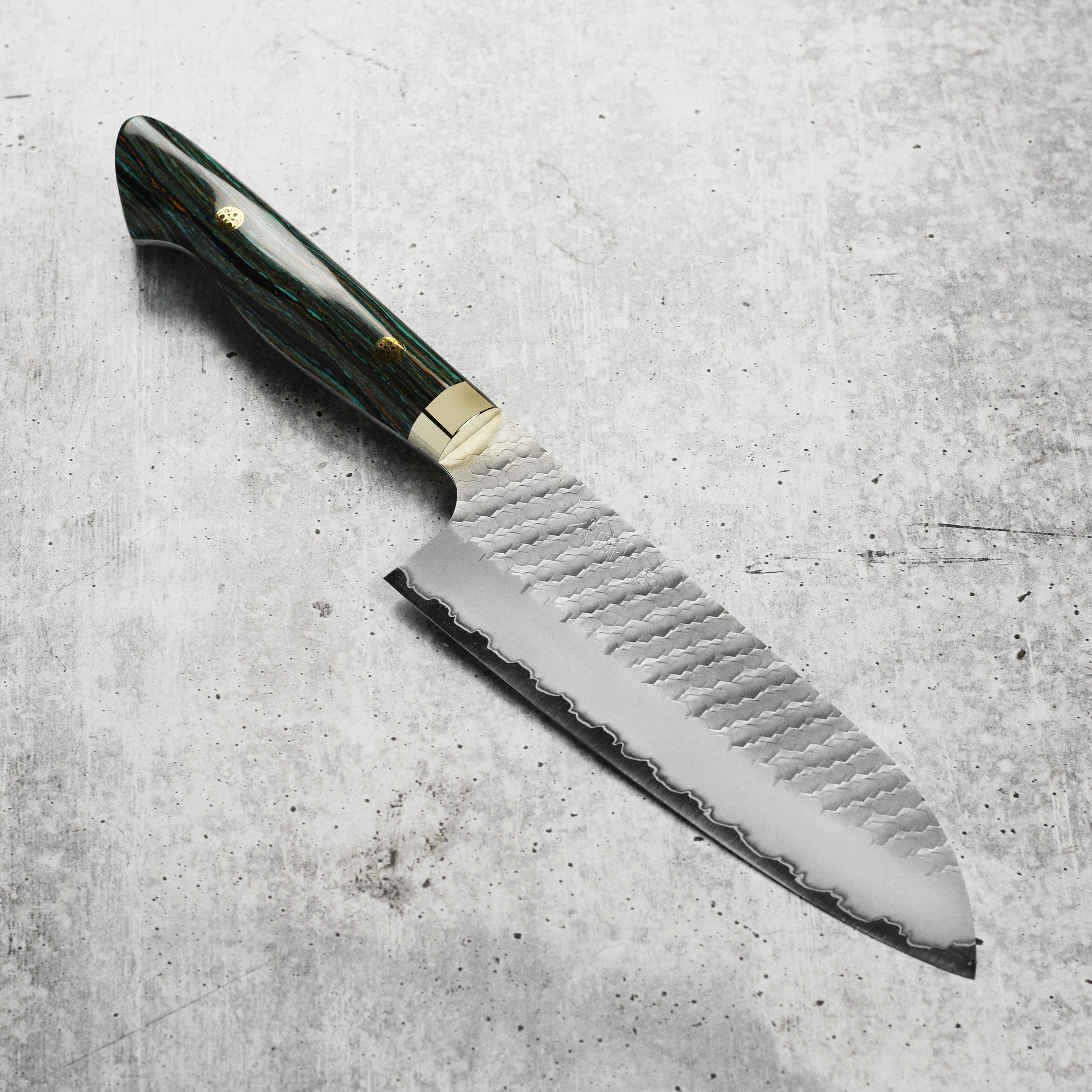 Nigara SG2 Santoku knife with striped turquoise handle on cutting board