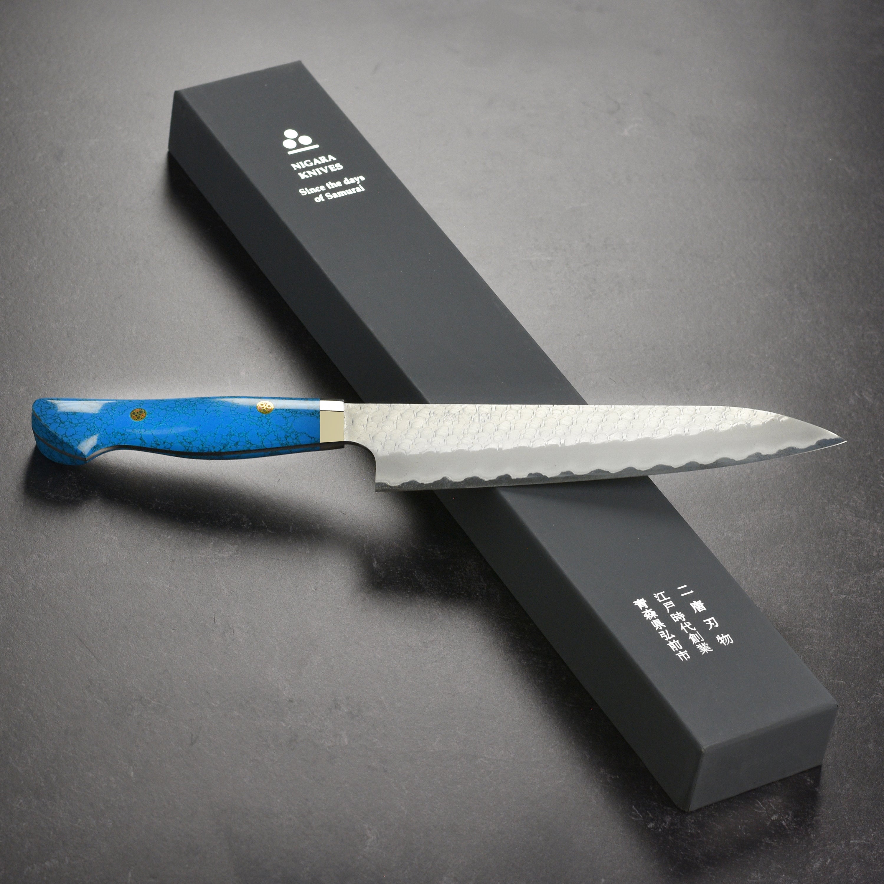 Close-up of the SG2 high carbon steel blade edge on the Nigara gyuto knife