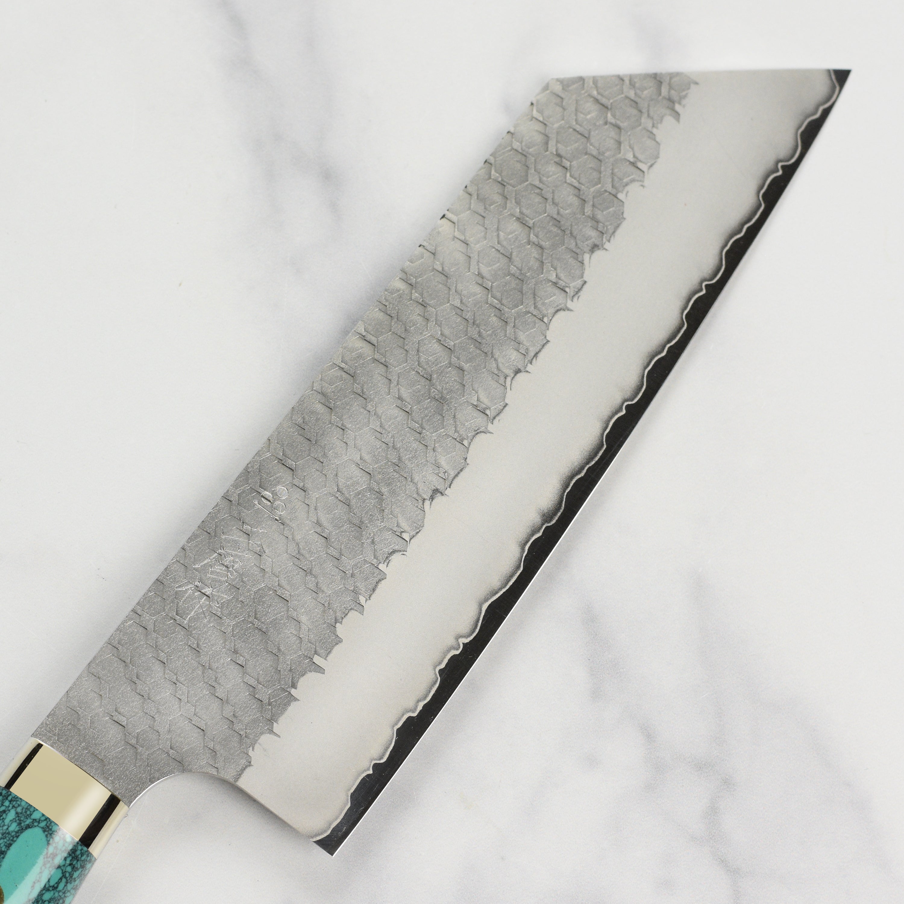 Close-up of Nigara SG2 Migaki Tsuchime 7-inch Kiritsuke Nakiri blade for precise vegetable slicing