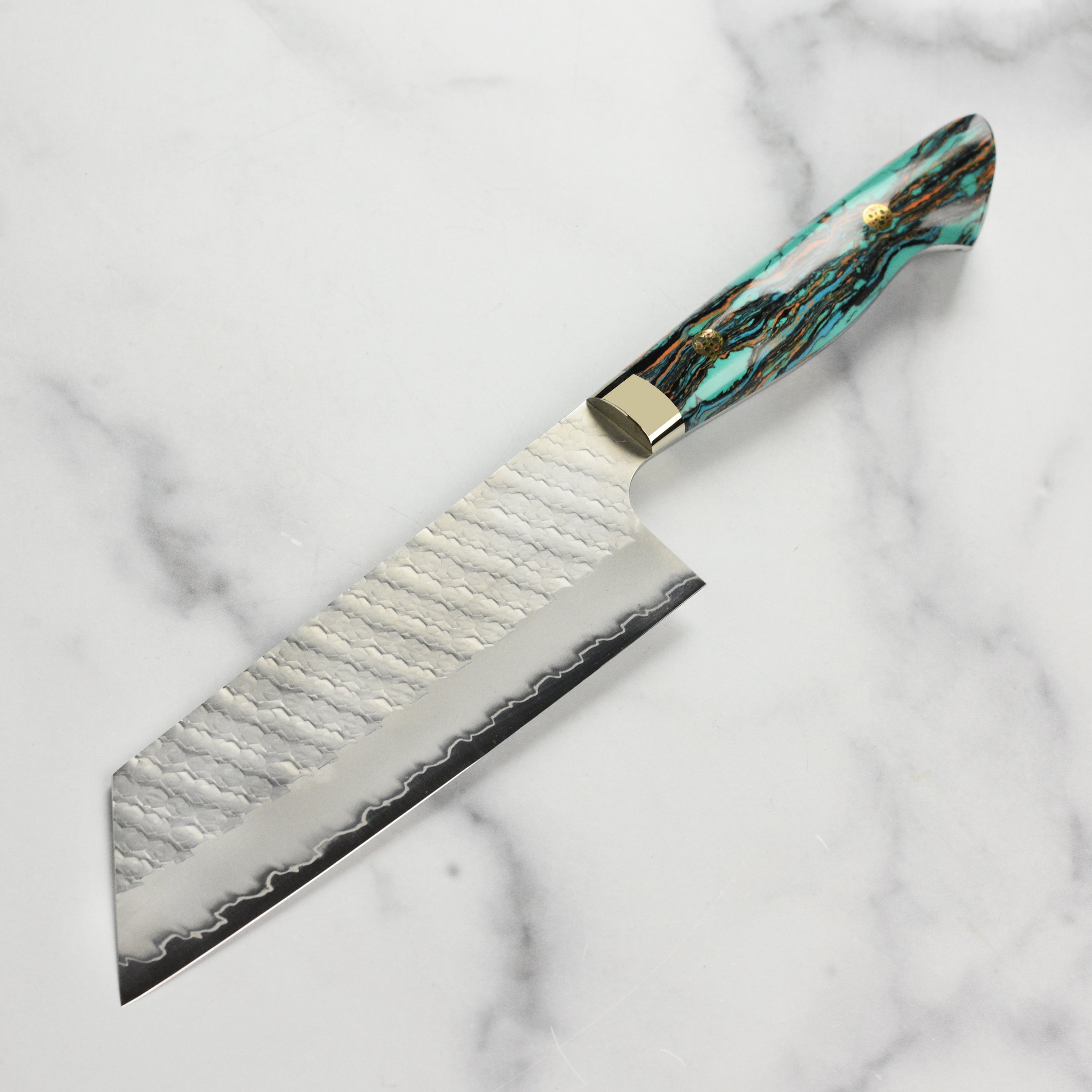Professional chef using the premium Japanese kitchen knife to chop vegetables.