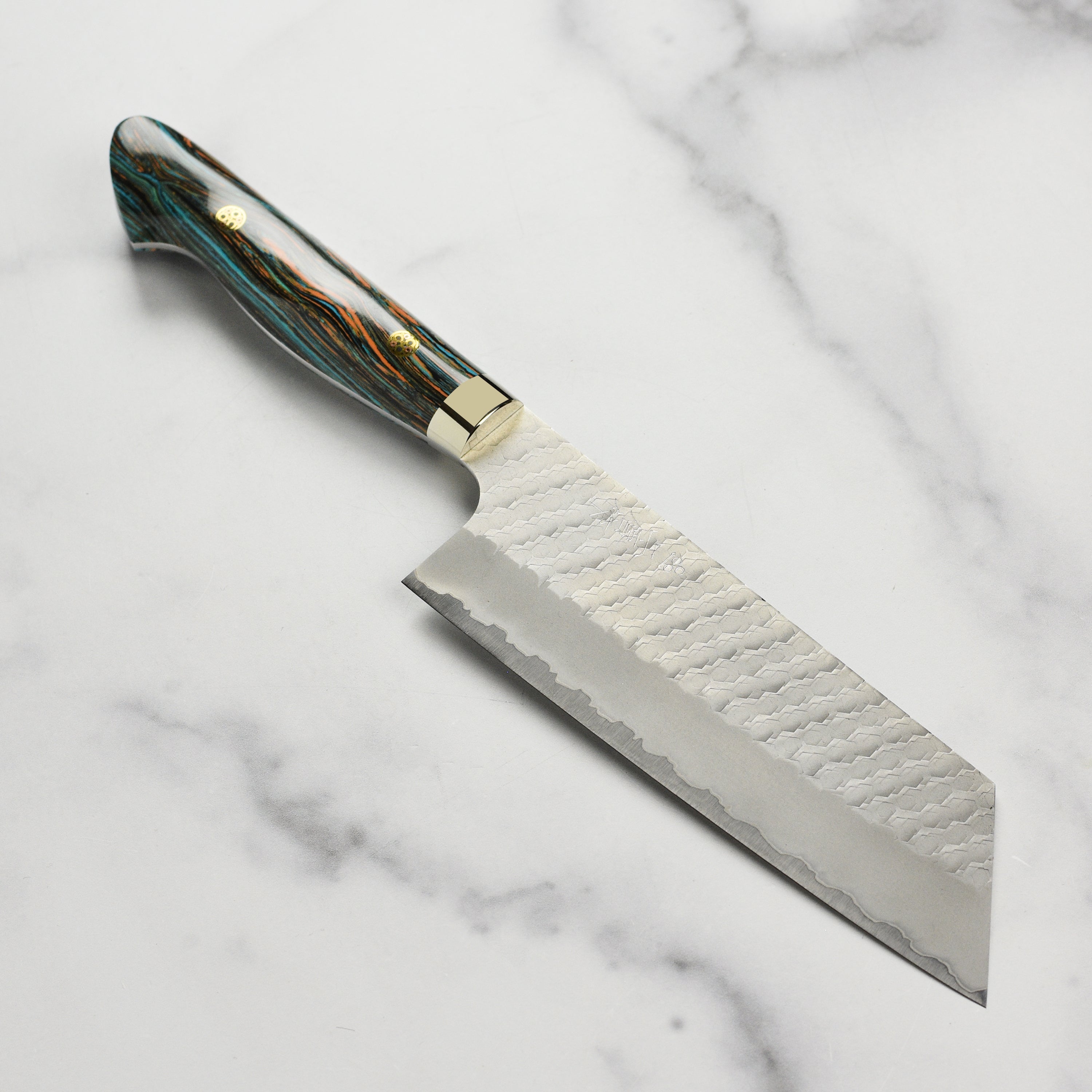 Turquoise striped SG2 Kiritsuke Nakiri knife shown from above, highlighting the blade and handle.