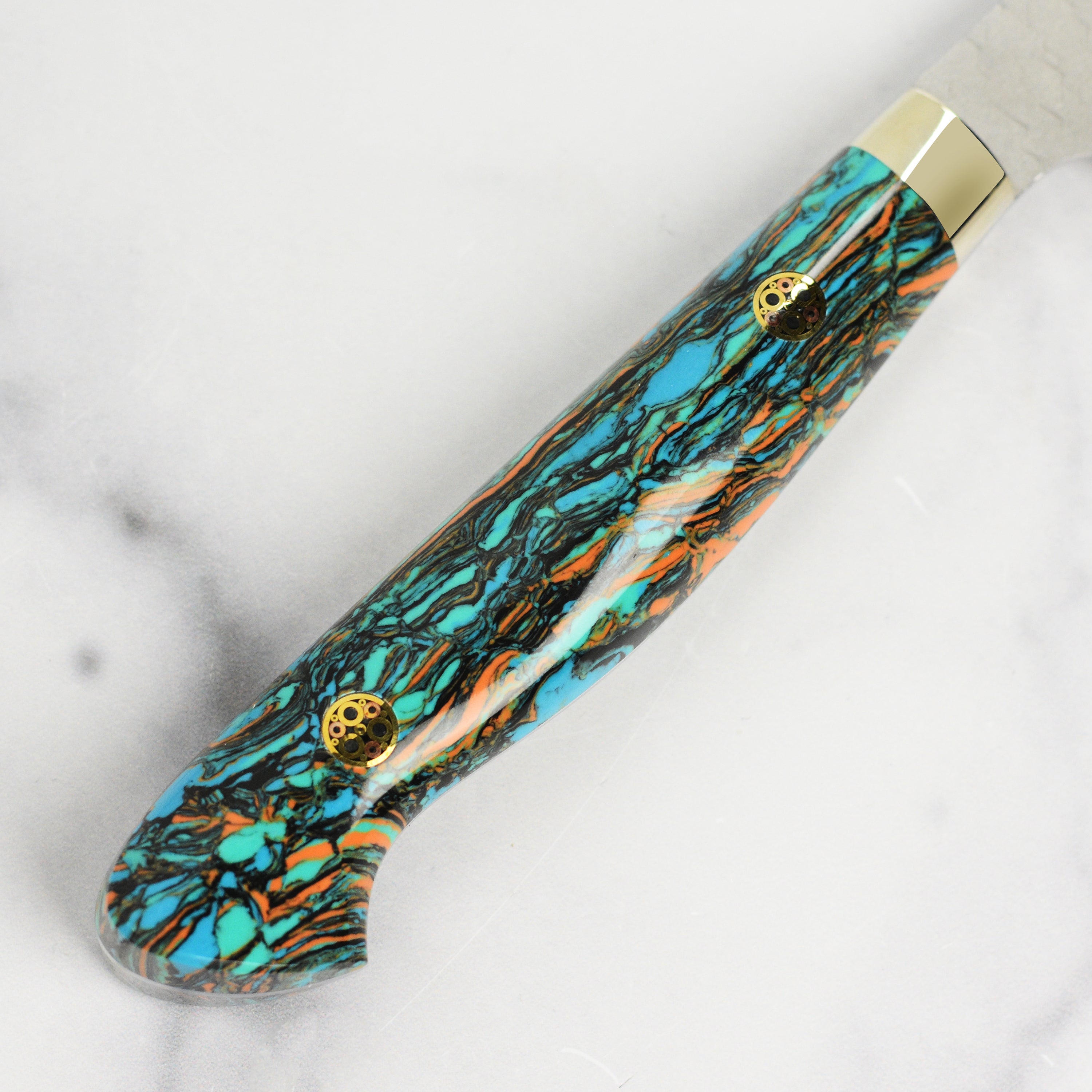 Nigara SG2 Kiritsuke chef knife angled view with marbled turquoise handle.