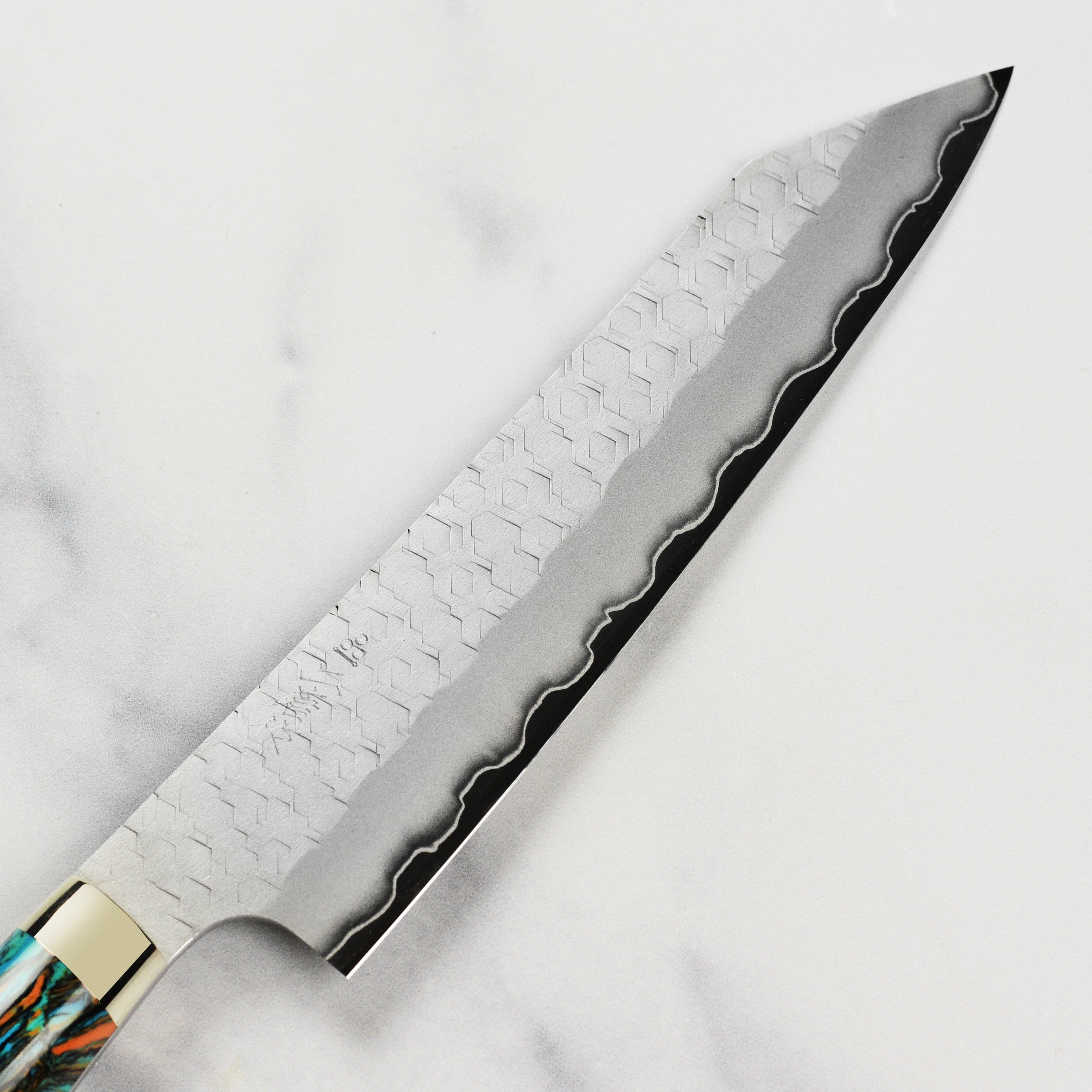 Nigara SG2 Kiritsuke chef knife angled view with marbled turquoise handle.