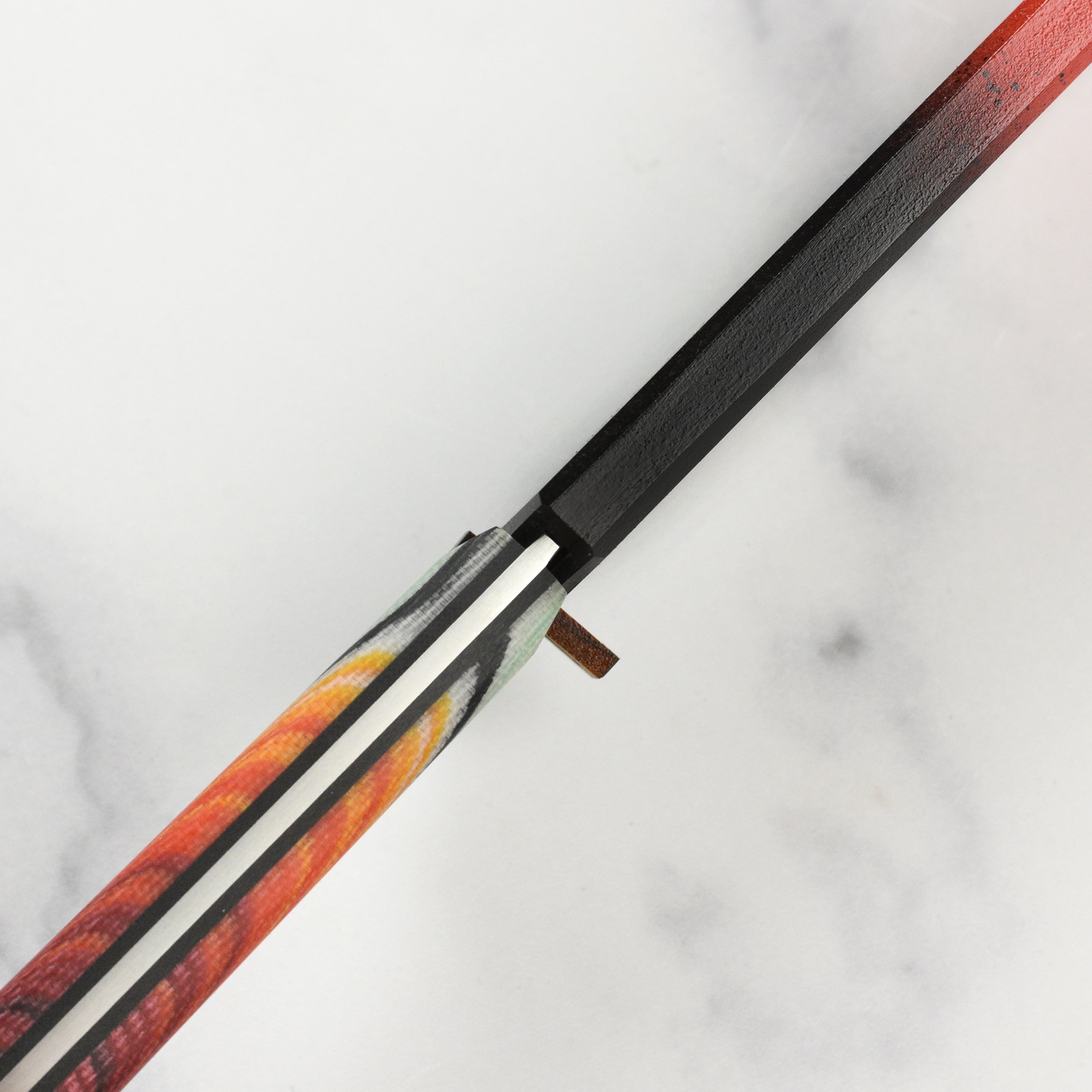 Close-up of the Mexican blanket-inspired G-Carta handle on the handmade chefs knife