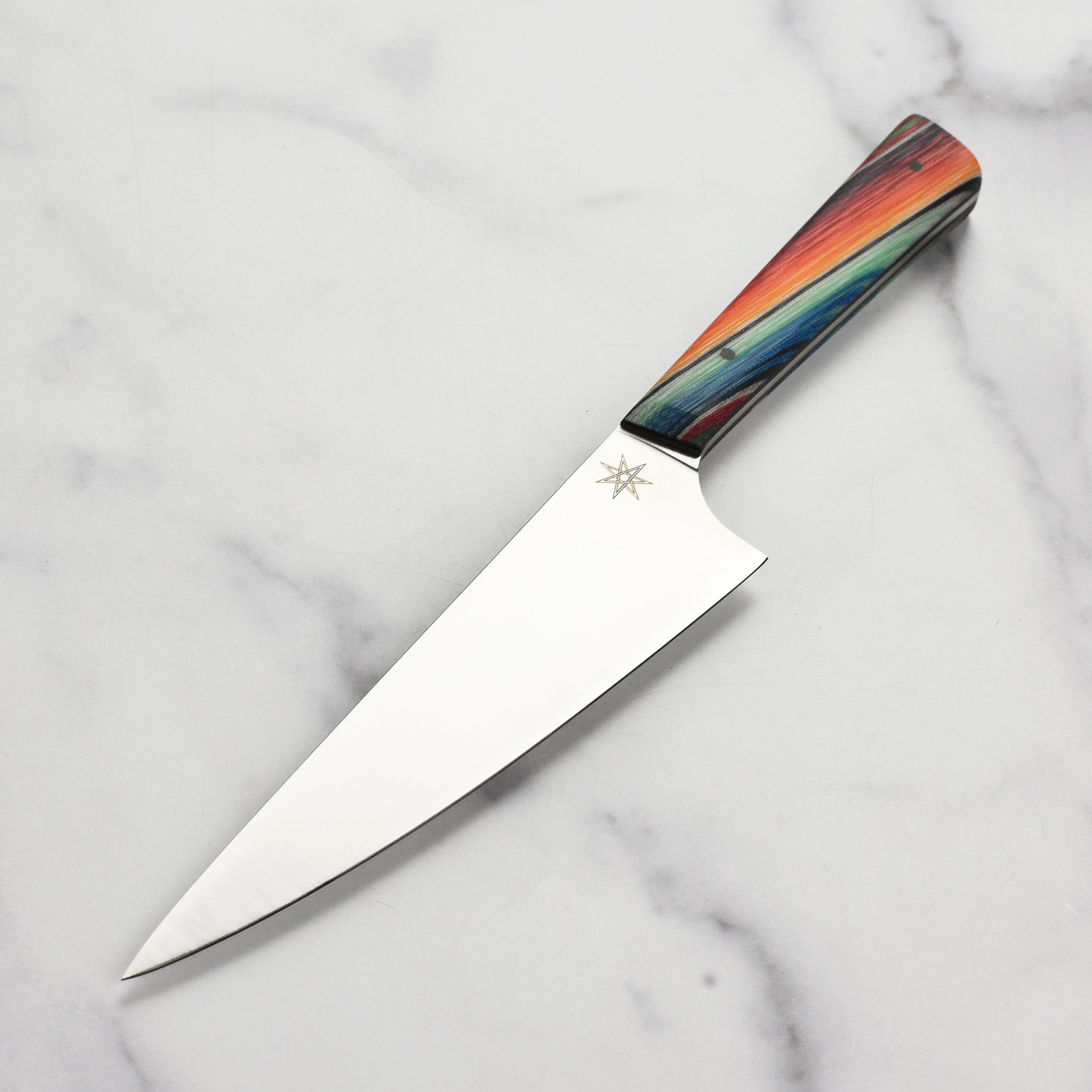 Baja Pro 7-Inch Japanese Chef's Knife with Nitro-V stainless steel blade, showcasing its sharp edge and elegant handle.
