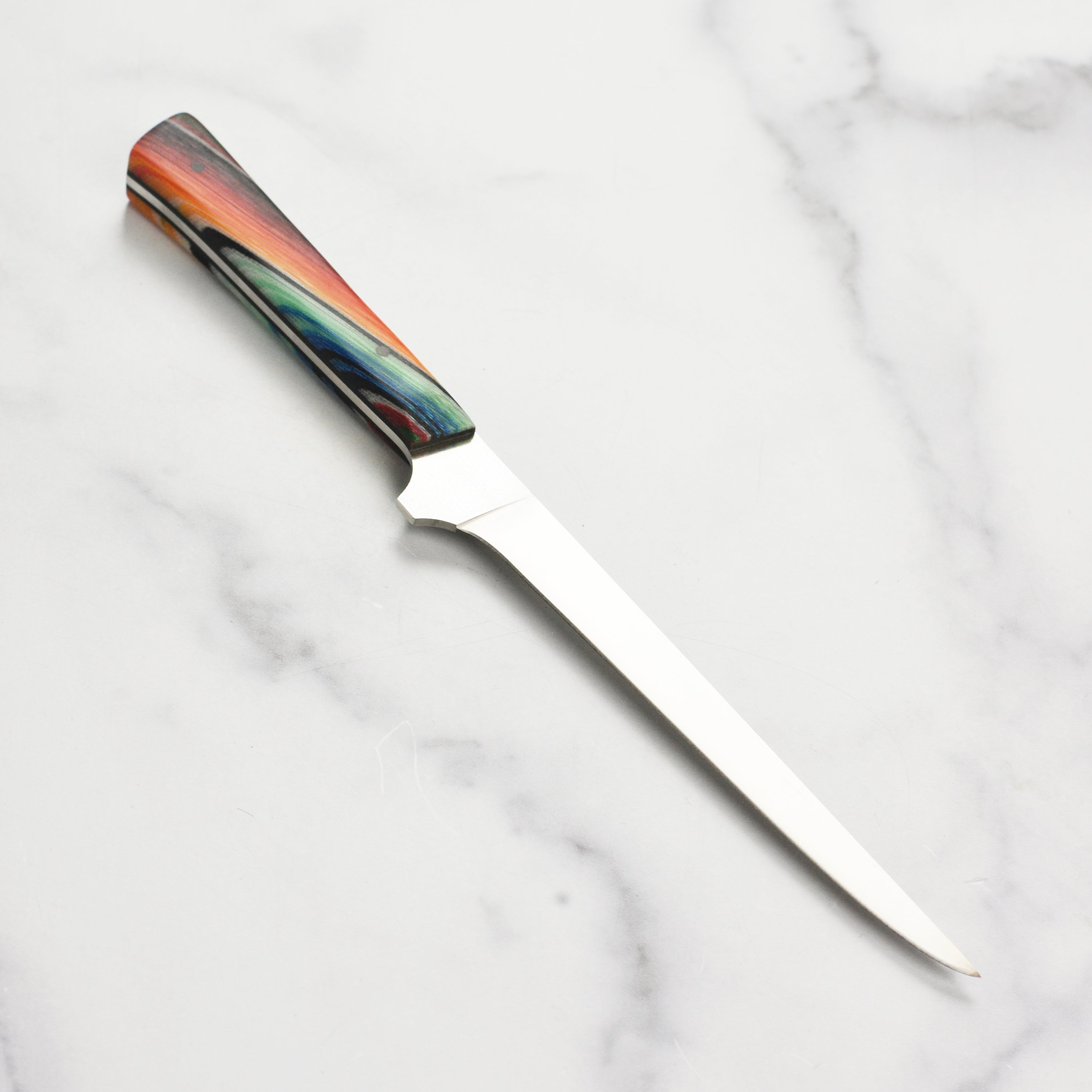 Town Cutler Baja 6" Precision Boning Knife on a cutting board with fresh meat