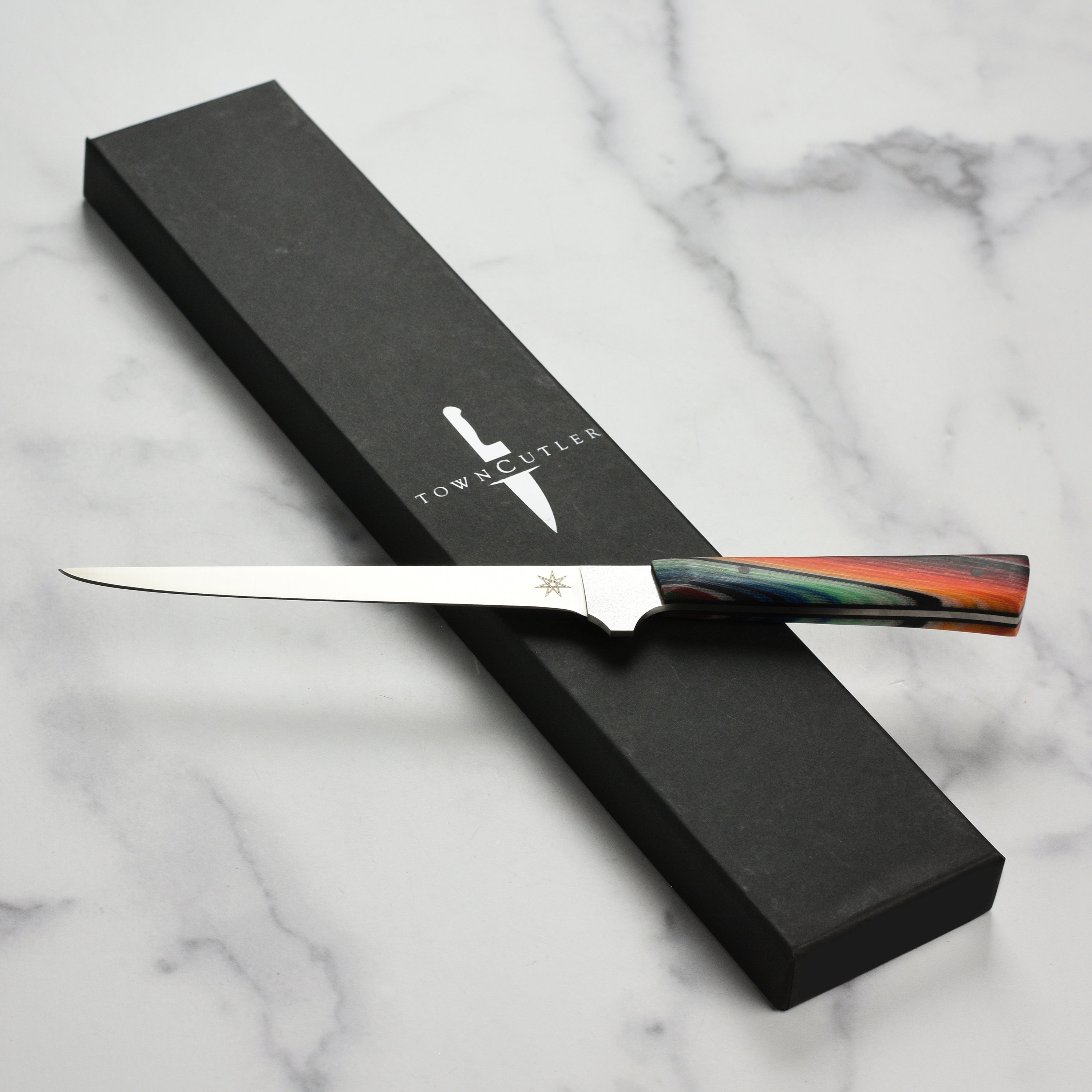 Close-up of Town Cutler Baja 6" Precision Boning Knife showing the sharp edge and handle