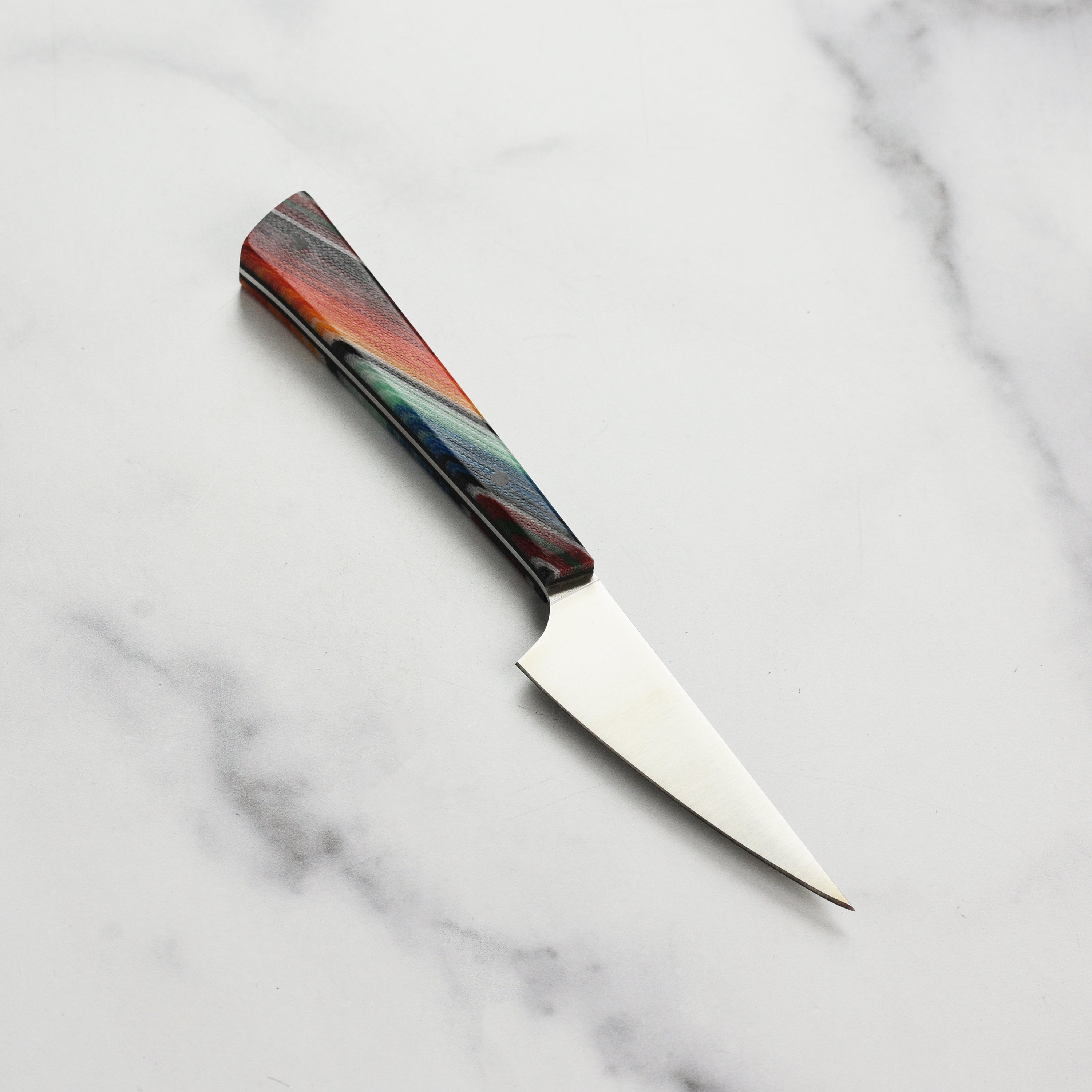 Close-up of the Nitro-V steel blade on a handmade kitchen knife
