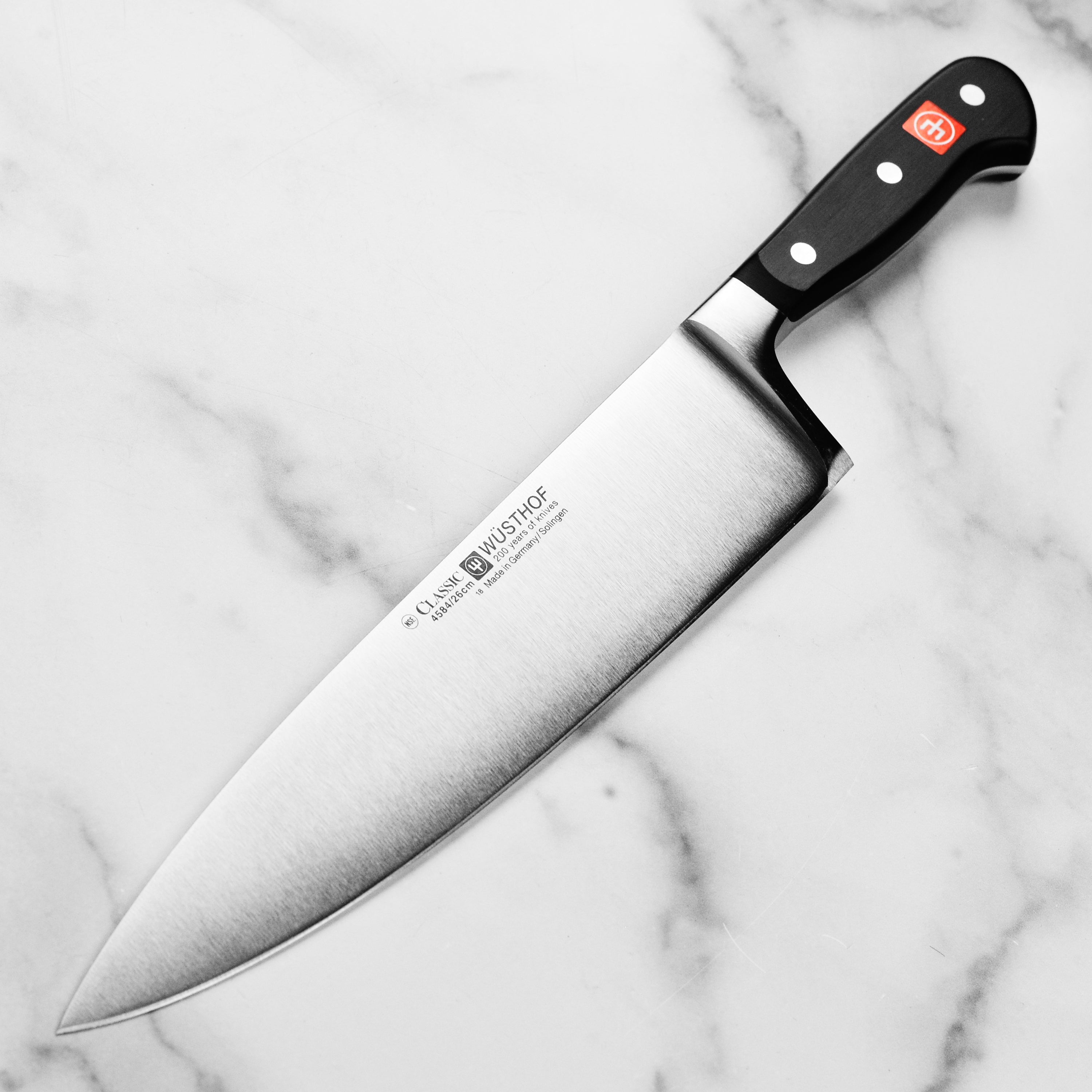 Side view of the German kitchen knife showing full tang and triple-riveted handle