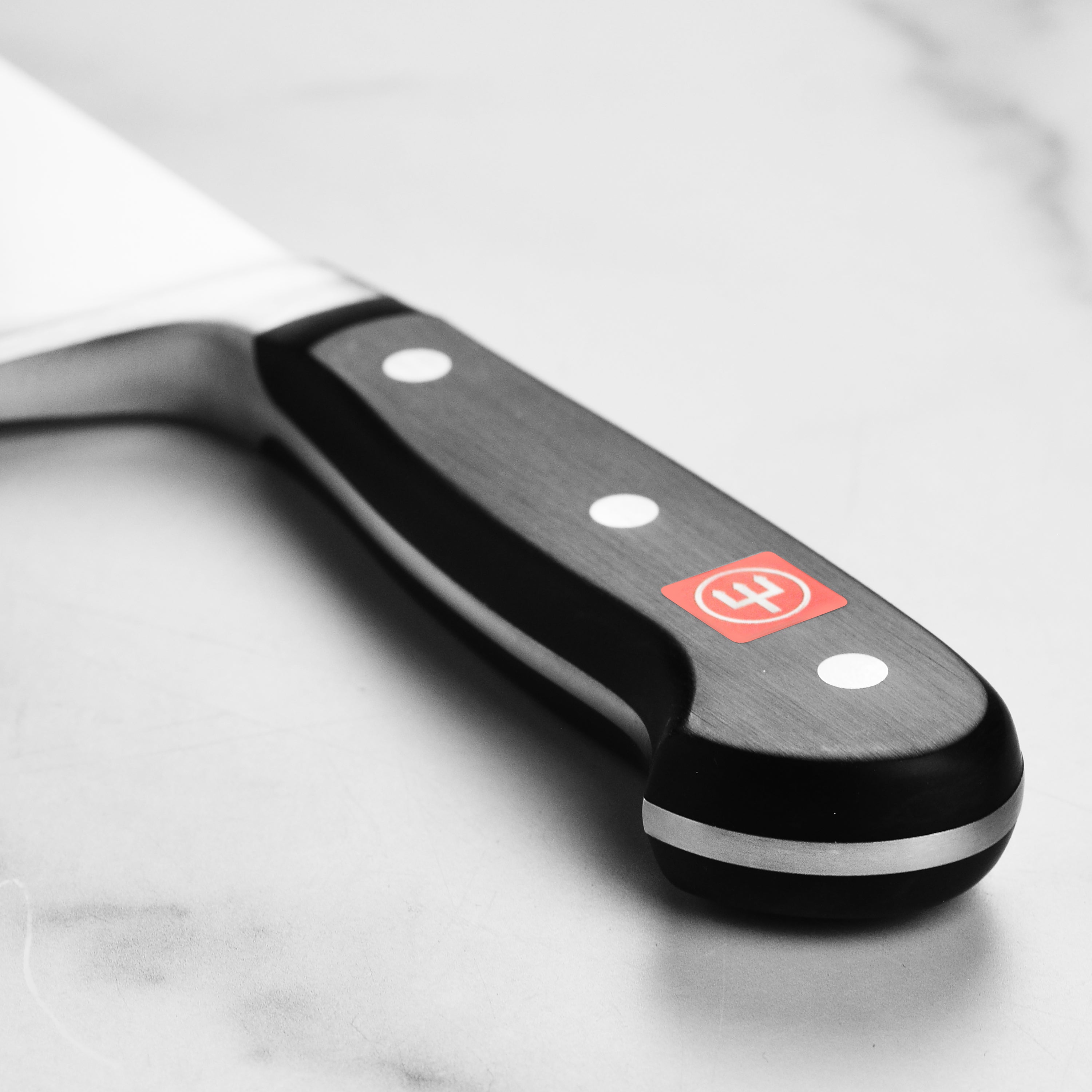 Side view of the German kitchen knife showing full tang and triple-riveted handle